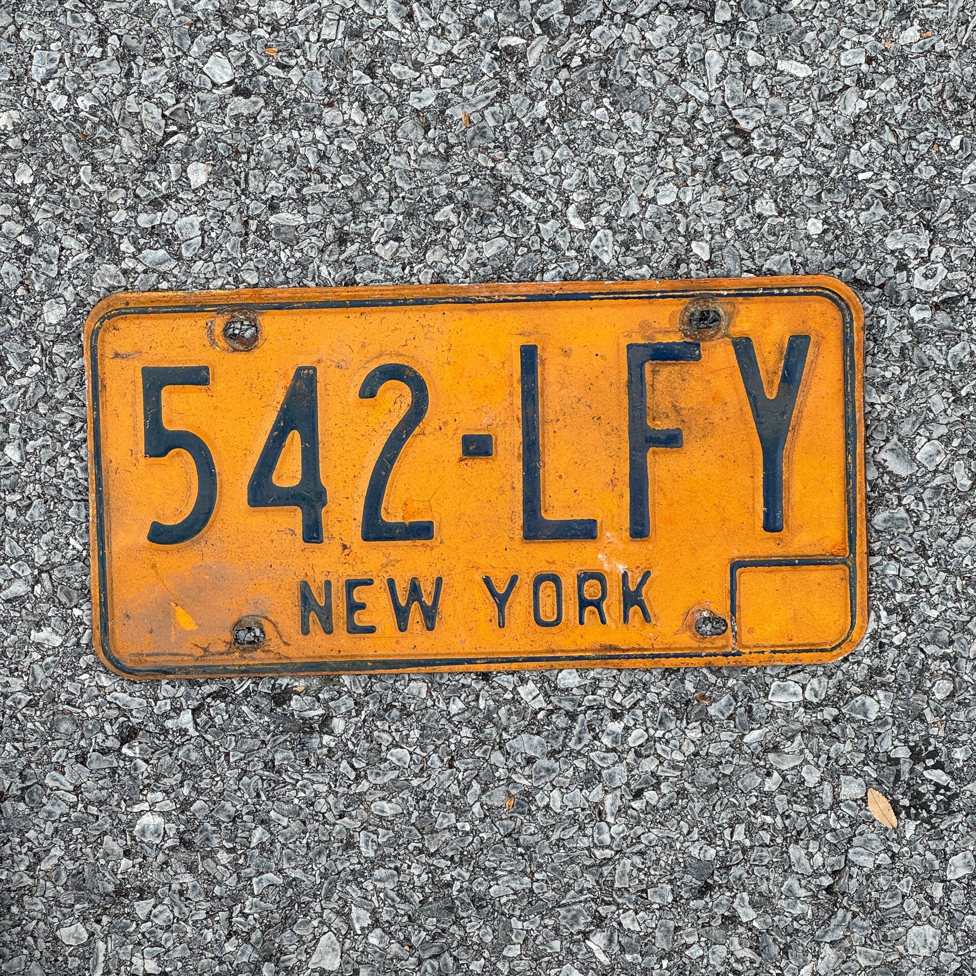 Photo of a 1973 New York License Plate Auto Tag Garage Decor Vintage 542 LFY