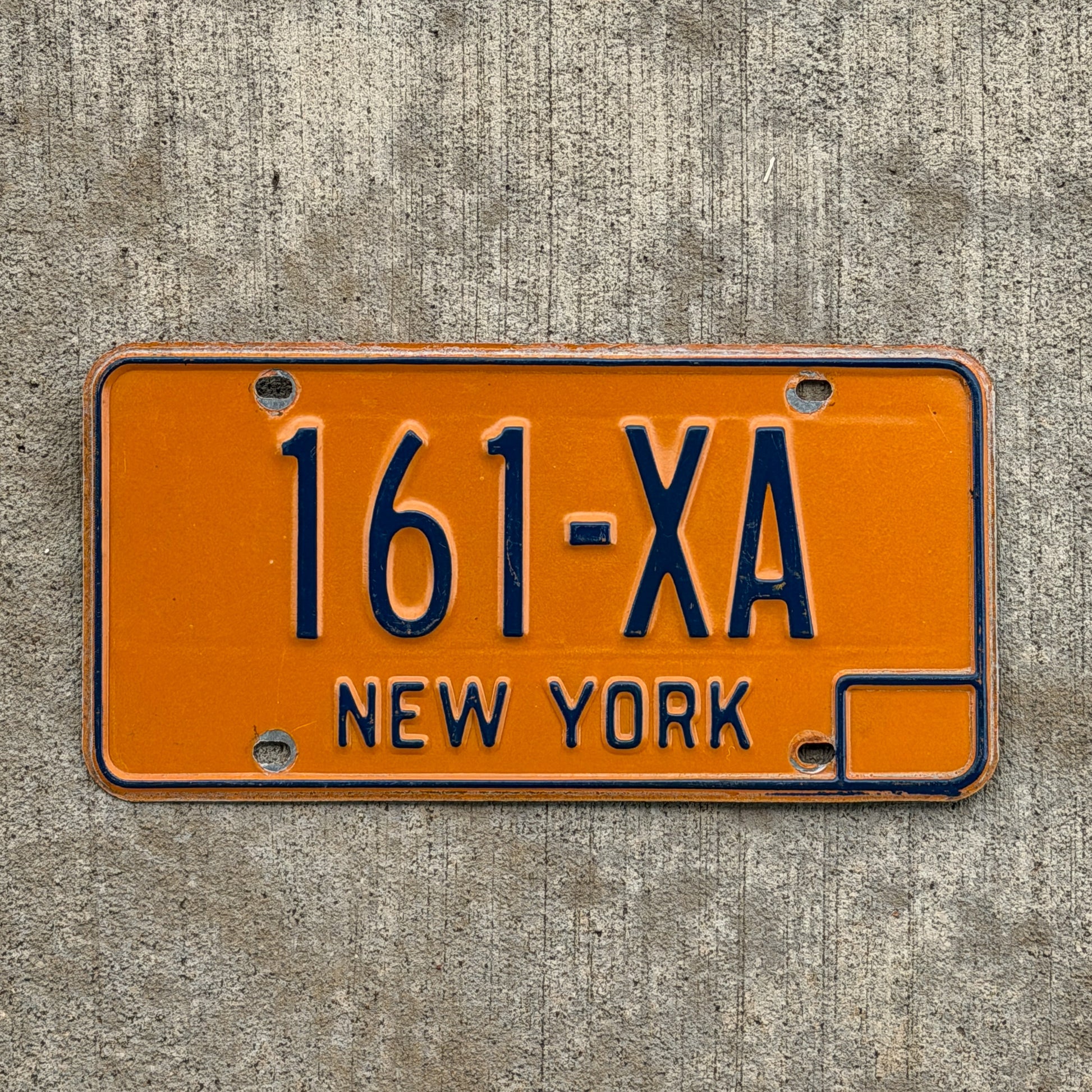 Photo of a 1973 New York License Plate Auto Tag Garage Decor Vintage Reserved Series 161 XA with original patina