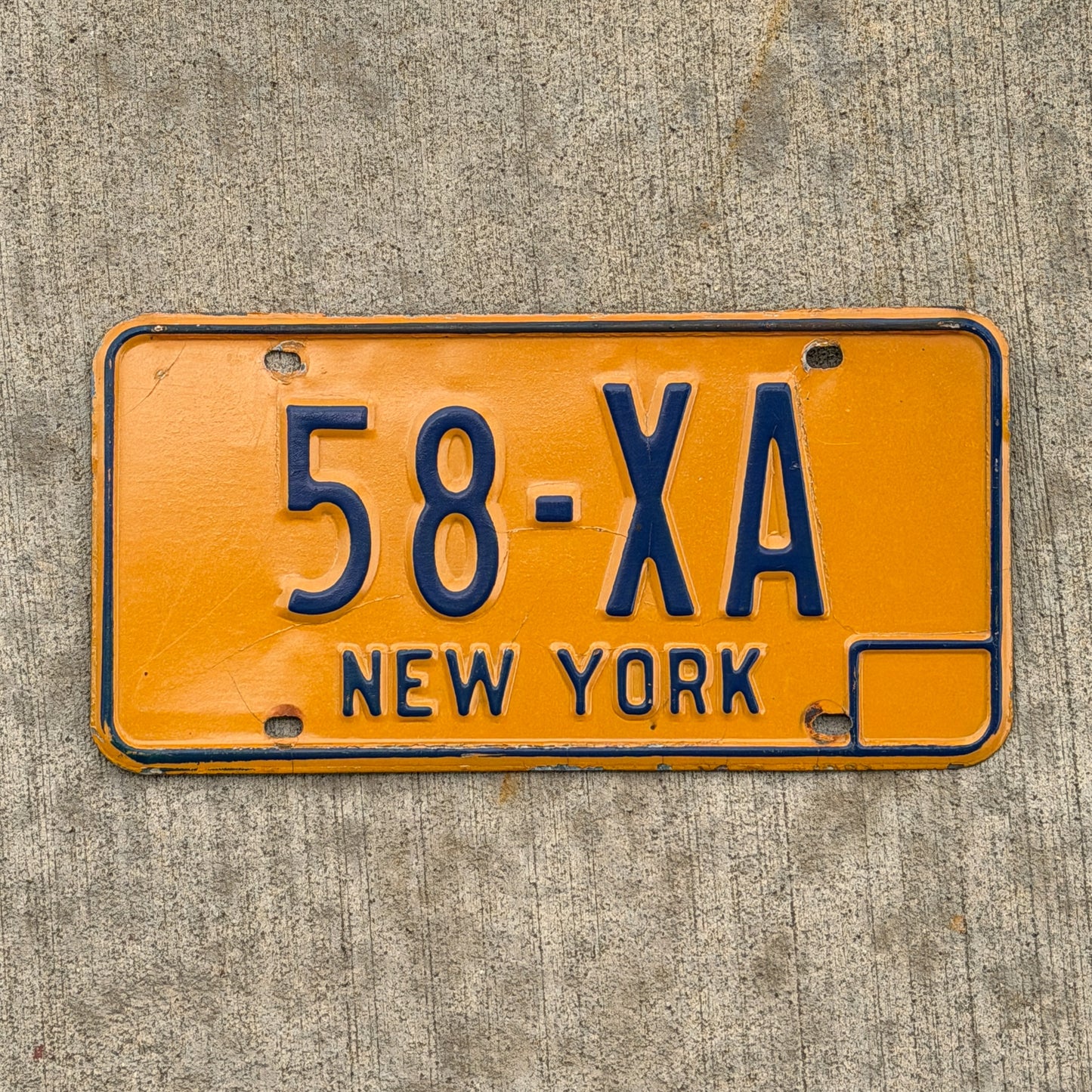Photo of a 1973 New York License Plate Auto Tag Garage Decor Vintage Reserved Series 58 XA with original patina