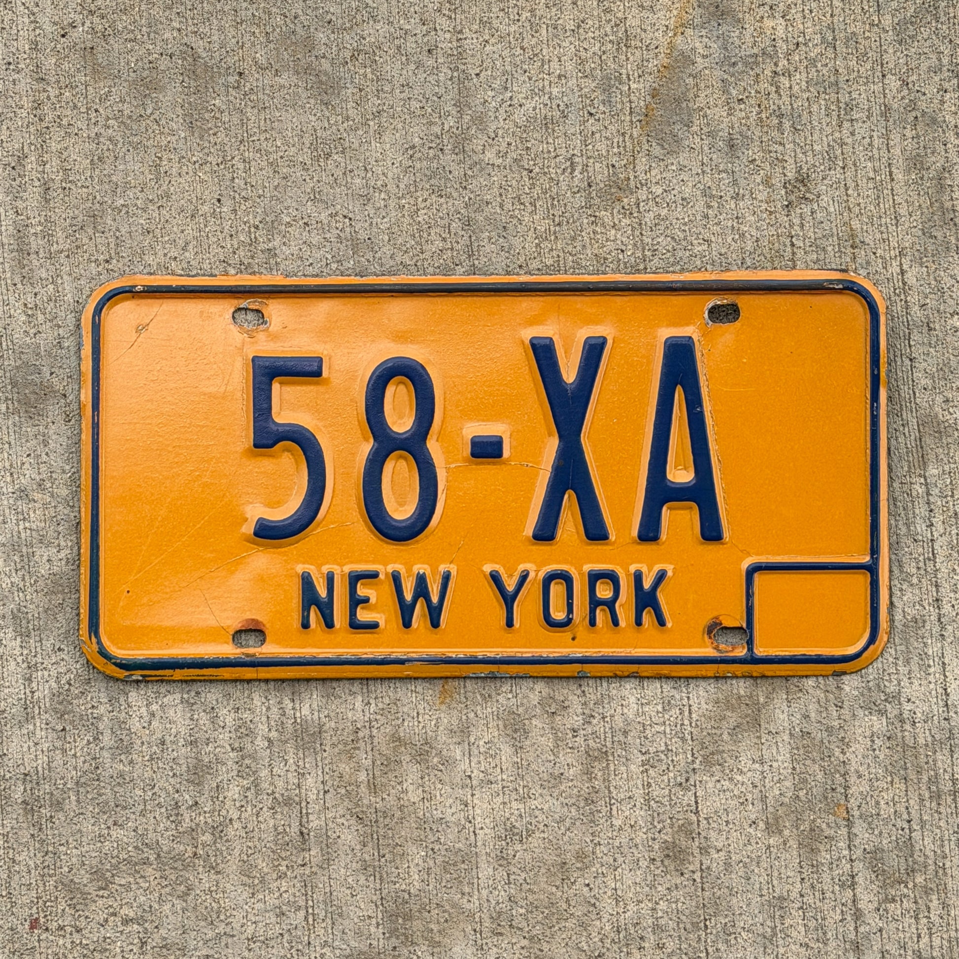 Photo of a 1973 New York License Plate Auto Tag Garage Decor Vintage Reserved Series 58 XA with original patina