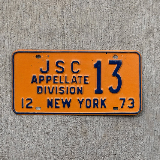 Photo of a 1973 New York Supreme Court Justice License Plate Auto Tag Garage Decor Vintage Appellate Division Judge 13 with original patina