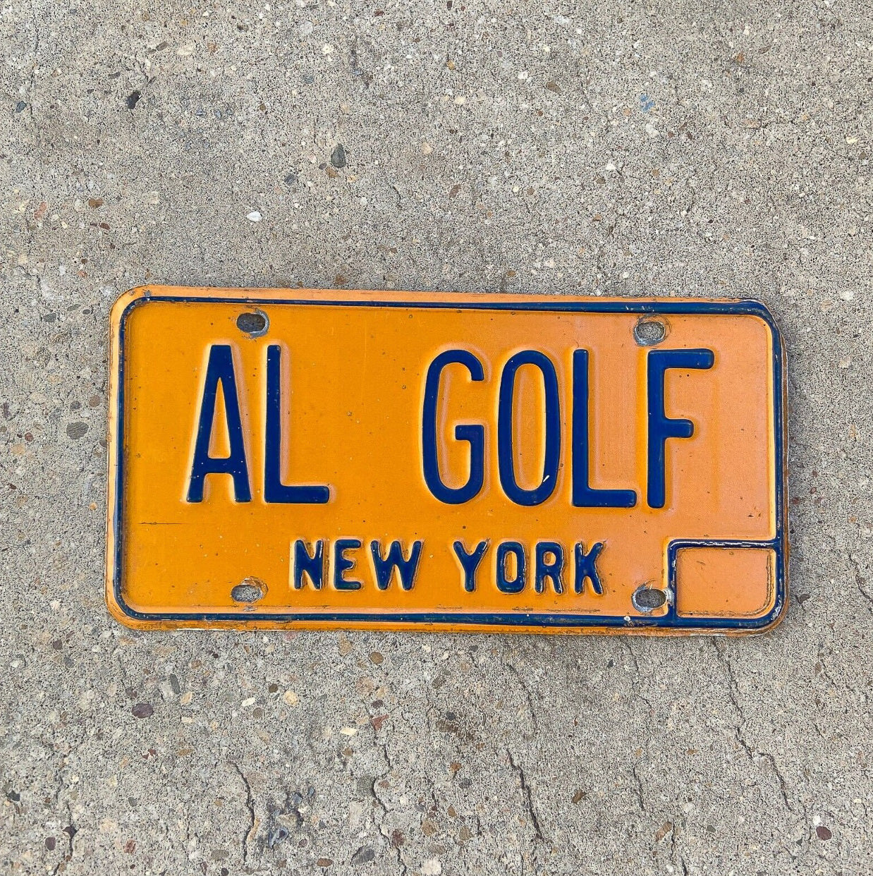 Photo of a 1973 New York Vanity License Plate Auto Tag Garage Decor Vintage Golf Golfer Sports AL GOLF with original patina