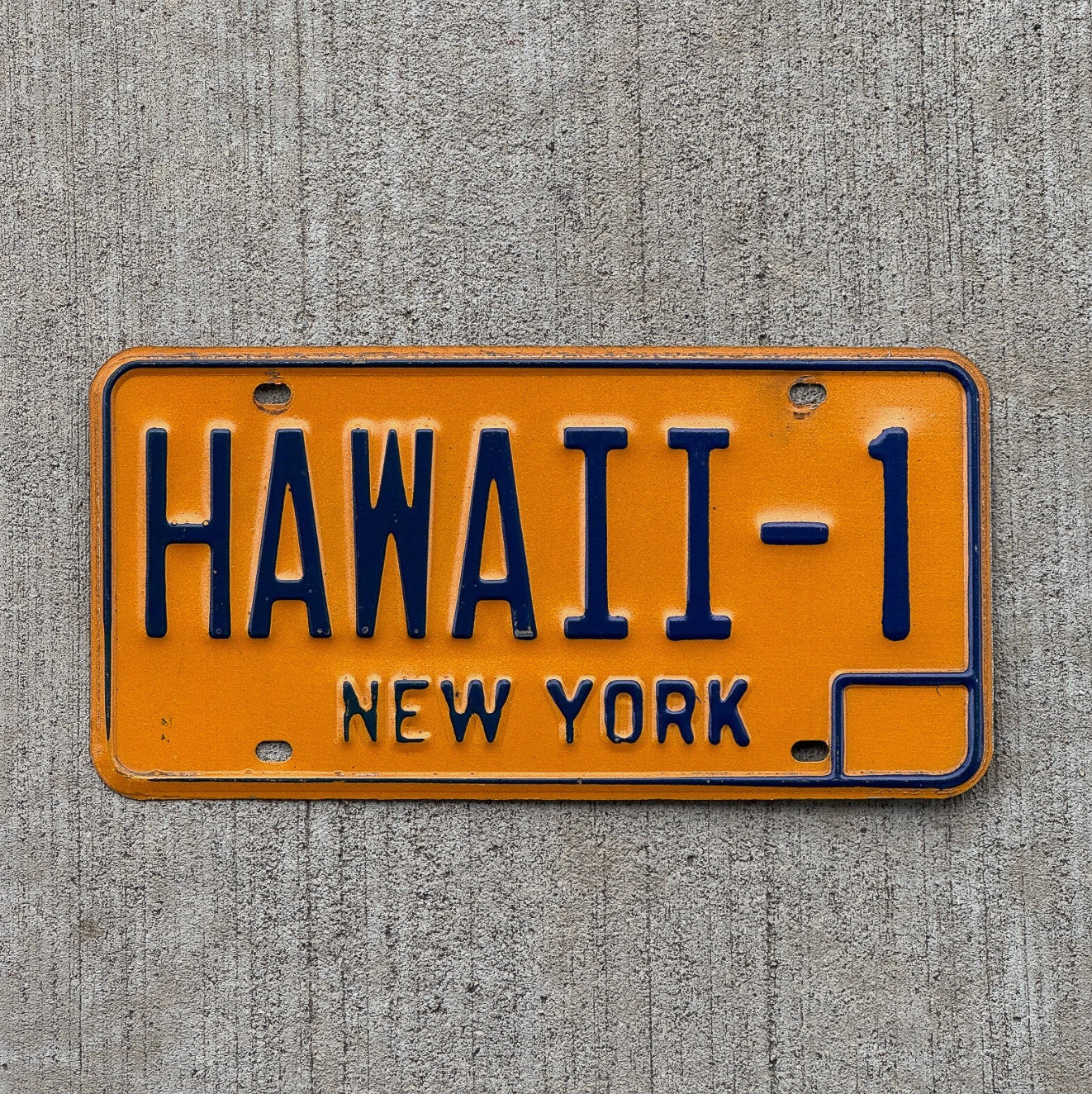 Photo of a 1973 New York Vanity License Plate Auto Tag Garage Decor Vintage Honeymoon Tropical Tiki Bar Vacation HAWAII 1 with original patina