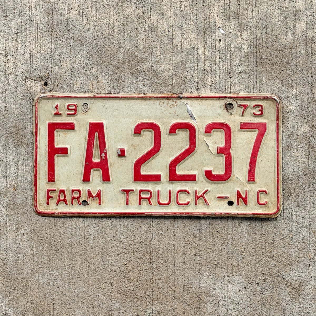 Photo of a 1973 North Carolina Farm Truck License Plate Auto Tag Garage Decor Vintage FA 2237 with original patina