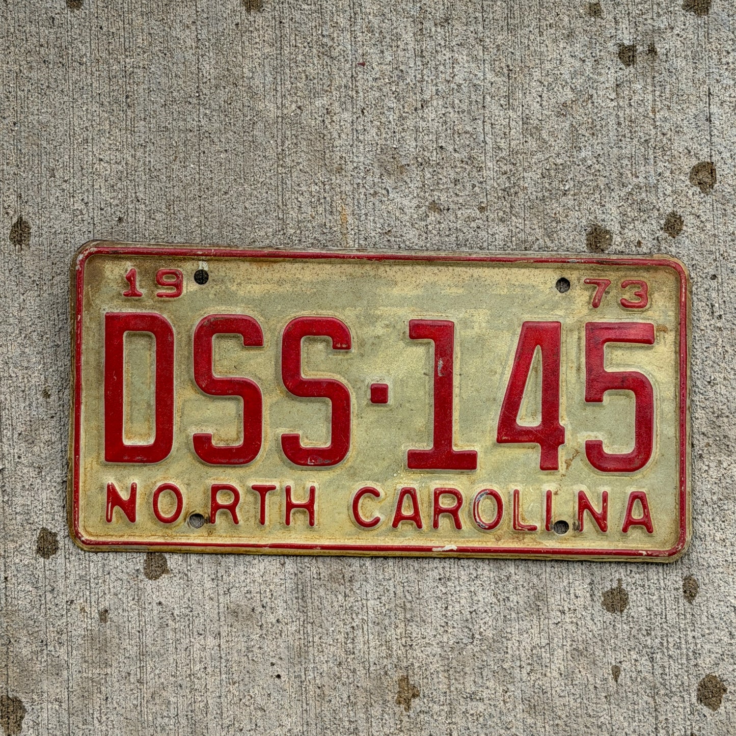 Photo of a 1973 North Carolina License Plate Auto Tag Garage Decor Vintage DSS 145 with original patina