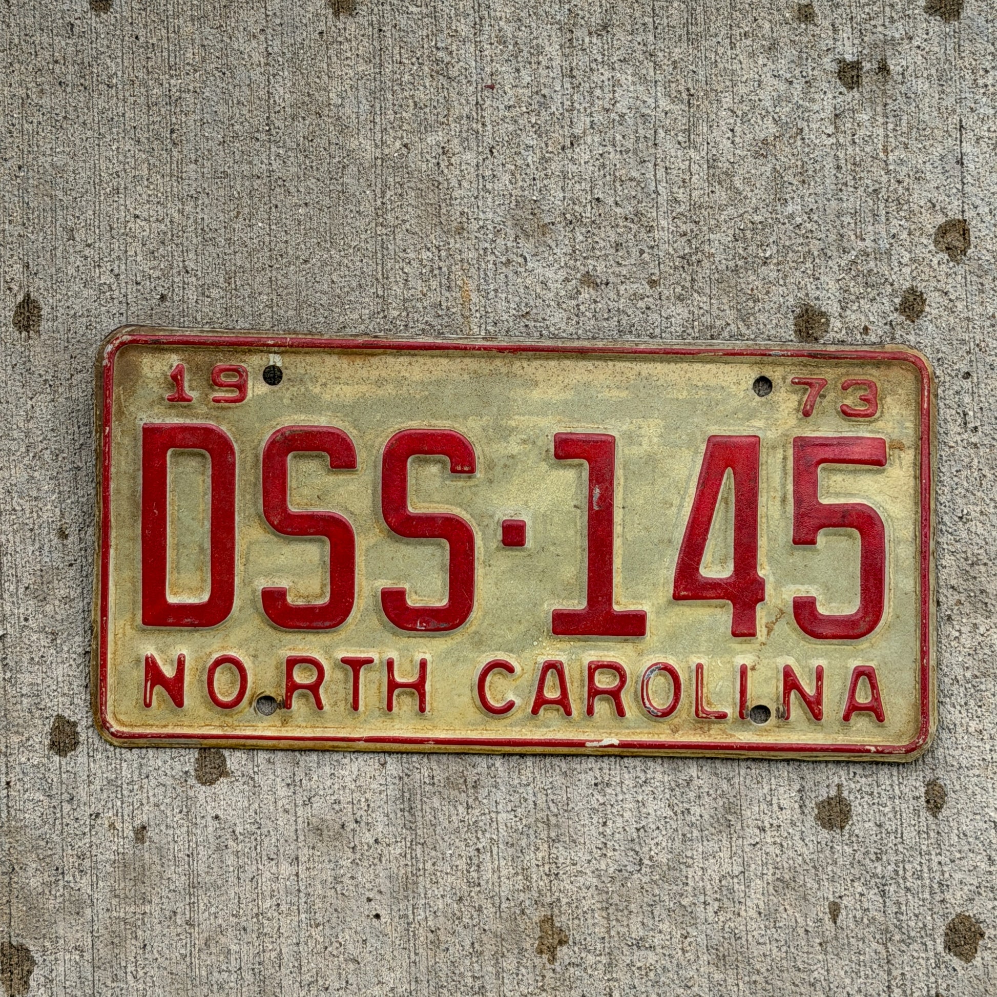 Photo of a 1973 North Carolina License Plate Auto Tag Garage Decor Vintage DSS 145 with original patina