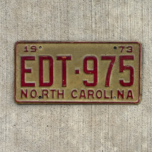 Photo of a 1973 North Carolina License Plate Auto Tag Garage Decor Vintage EDT 975 with original patina