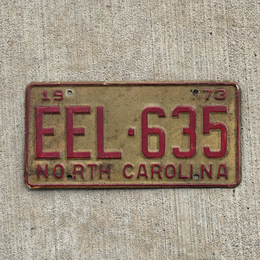 Photo of a 1973 North Carolina License Plate Auto Tag Garage Decor Vintage EEL 635 with original patina