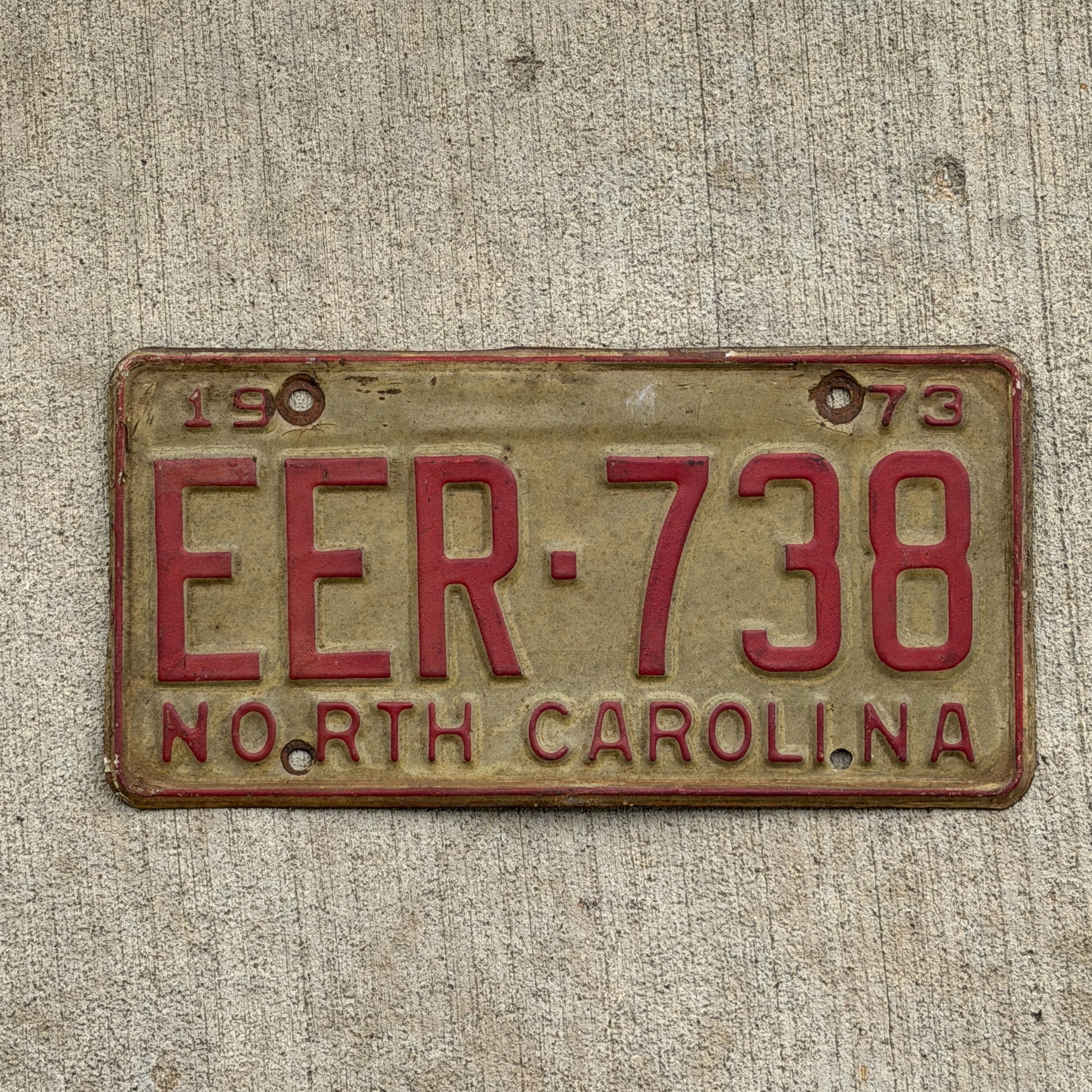 Photo of a 1973 North Carolina License Plate Auto Tag Garage Decor Vintage EER 738 with original patina