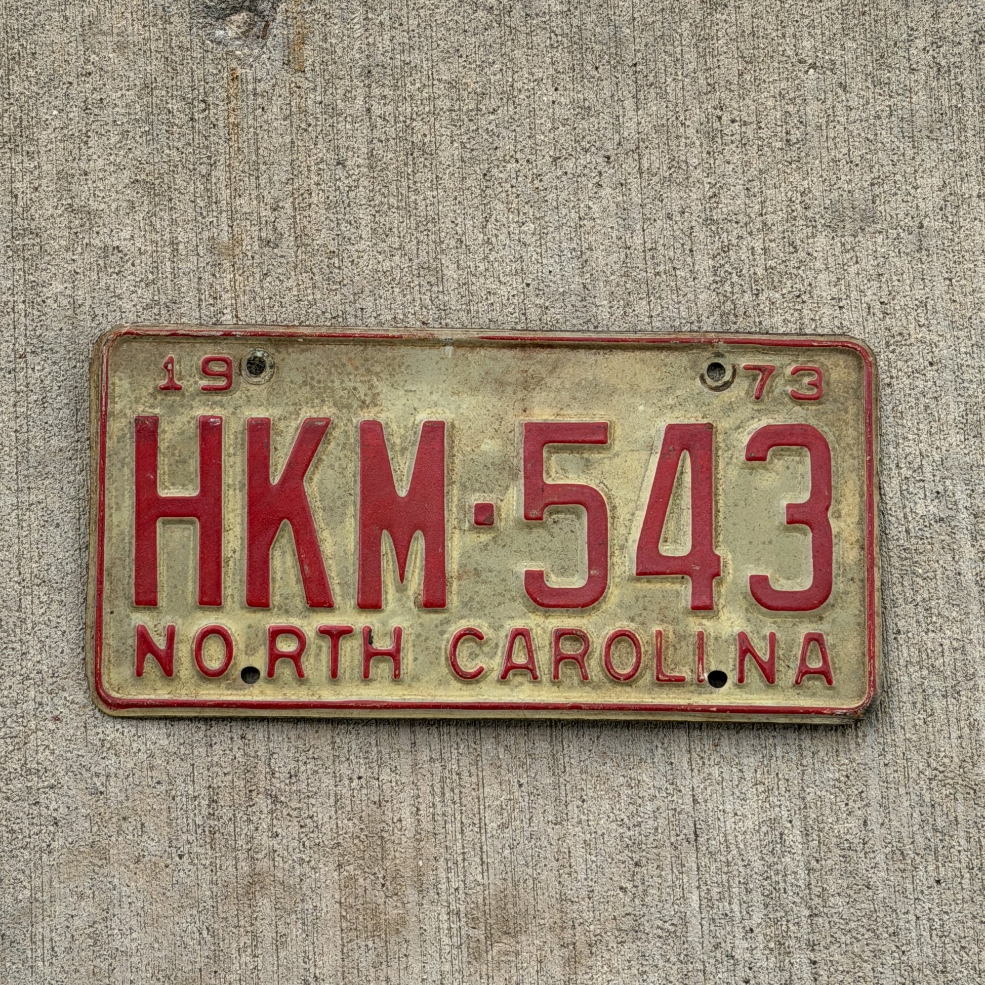 Photo of a 1973 North Carolina License Plate Auto Tag Garage Decor Vintage HKM 543 with original patina