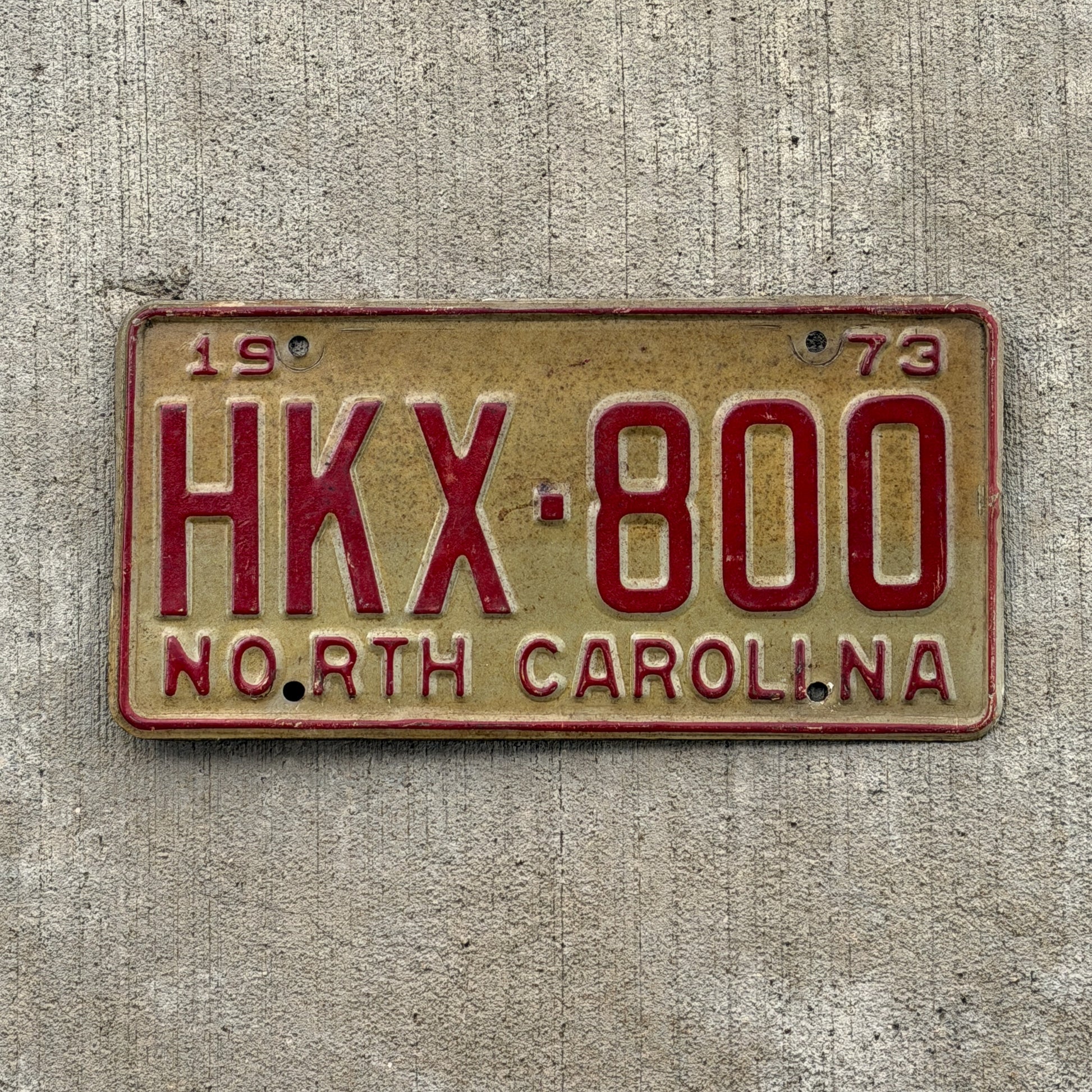 Photo of a 1973 North Carolina License Plate Auto Tag Garage Decor Vintage HKX 800 with original patina