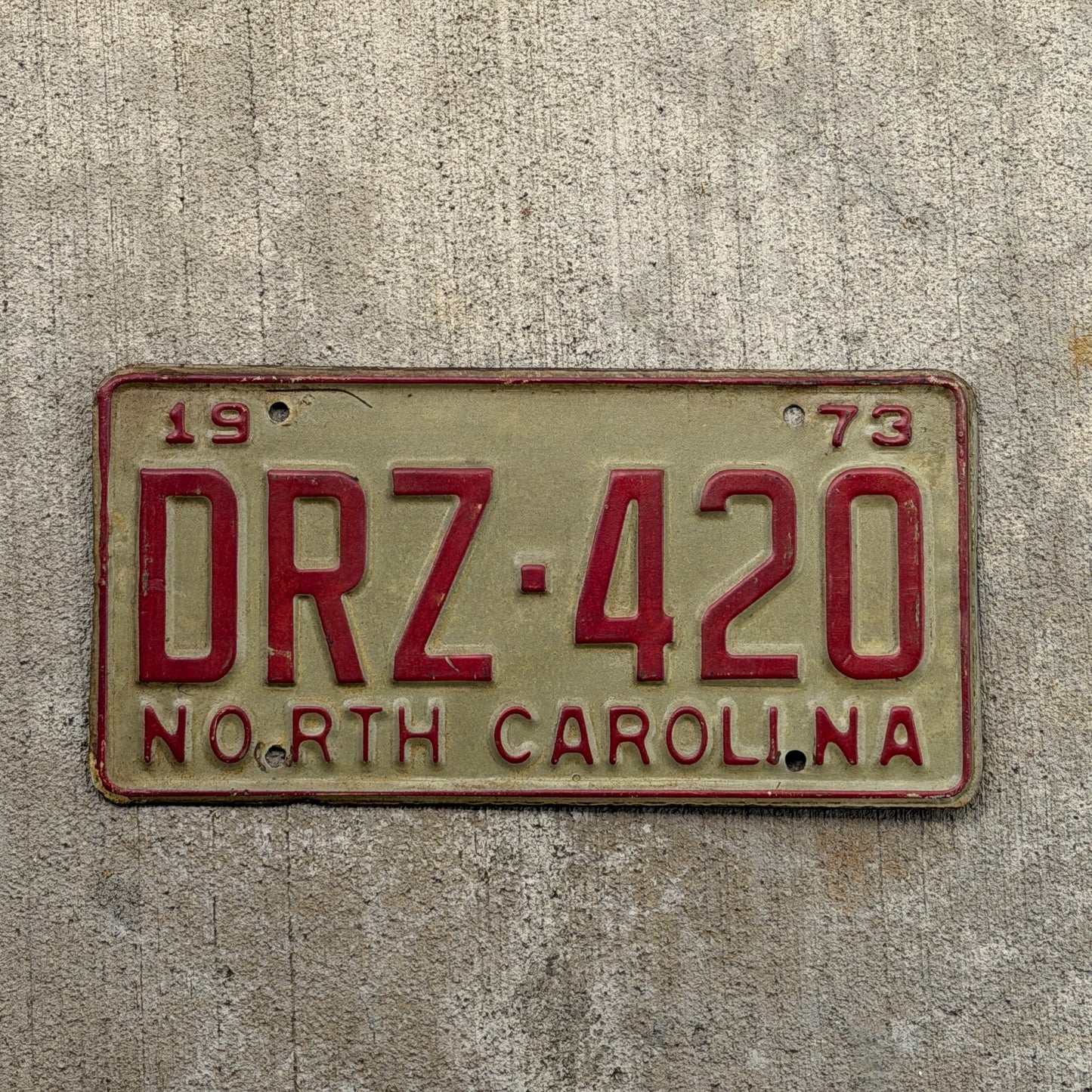Photo of a 1973 North Carolina License Plate Auto Tag Garage Decor Vintage Weed Smoke DRZ 420 with original patina