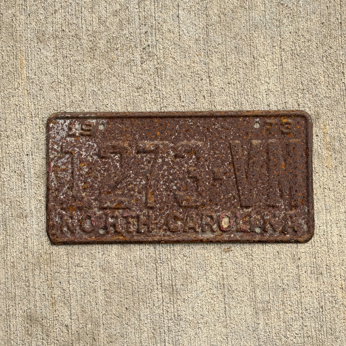 Photo of a 1973 North Carolina Truck License Plate Auto Tag Garage Decor Vintage 1273 VM with original patina