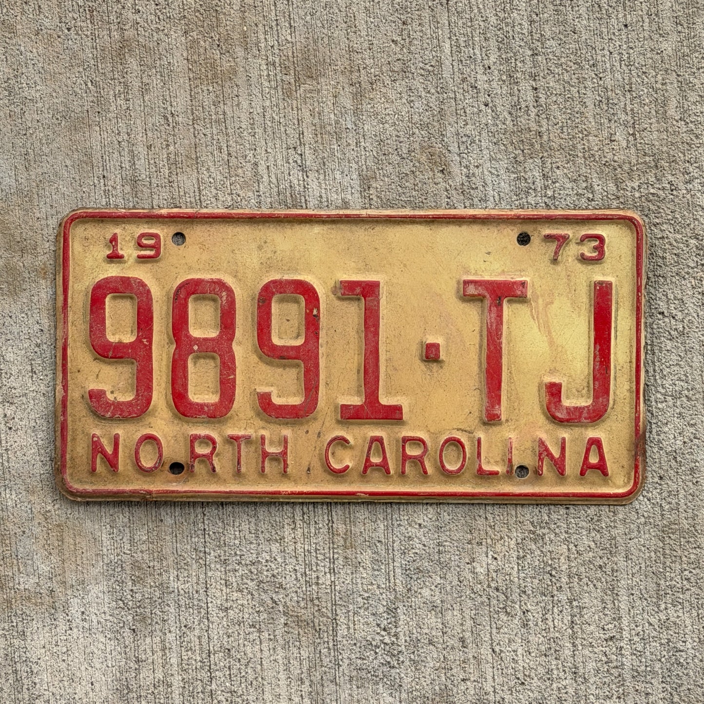 Photo of a 1973 North Carolina Truck License Plate Auto Tag Garage Decor Vintage 9891 TJ with original patina