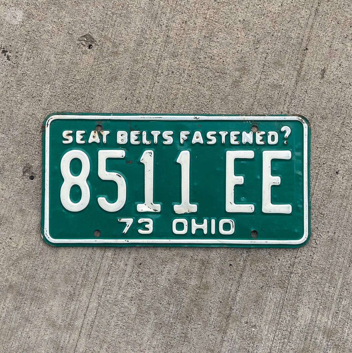 Photo of a 1973 Ohio License Plate Auto Tag Garage Decor Vintage 8511 EE with original patina