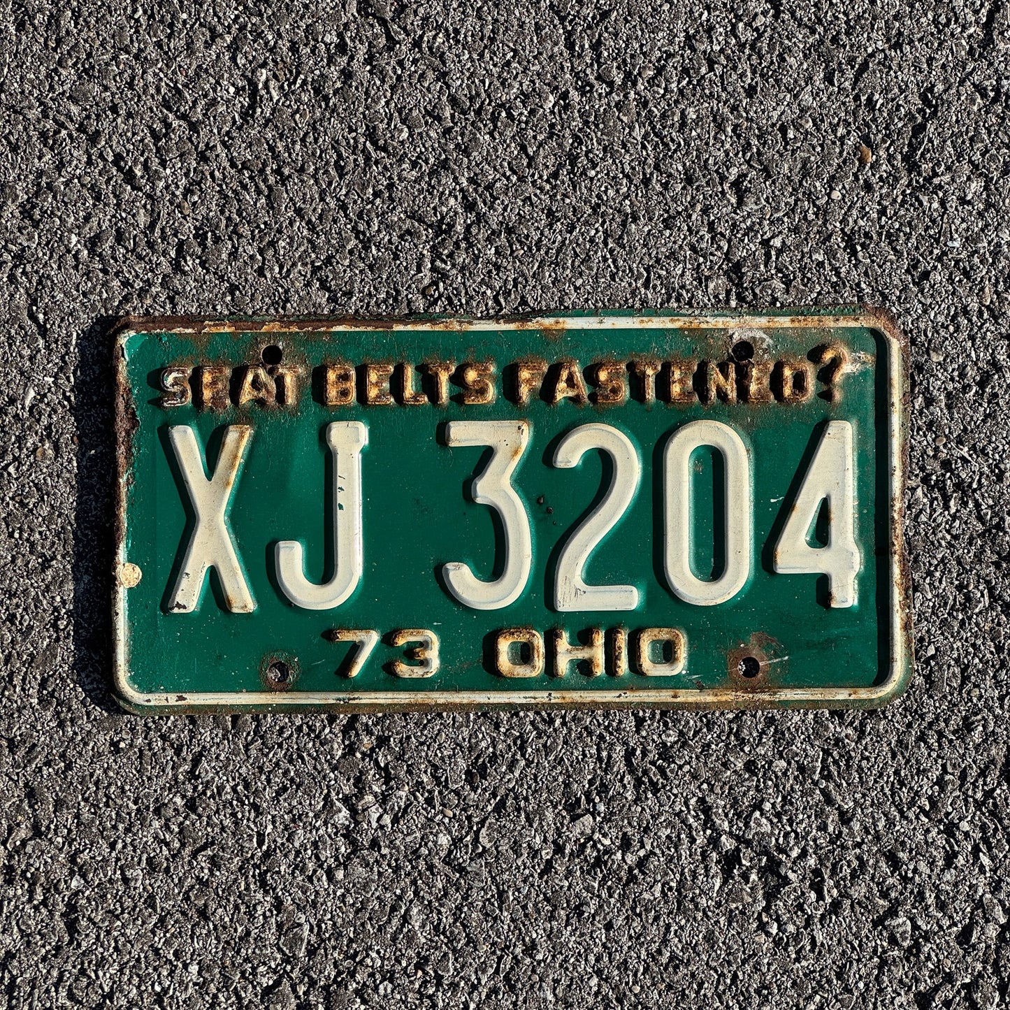 Photo of a 1973 Ohio License Plate Auto Tag Garage Decor Vintage XJ 3204