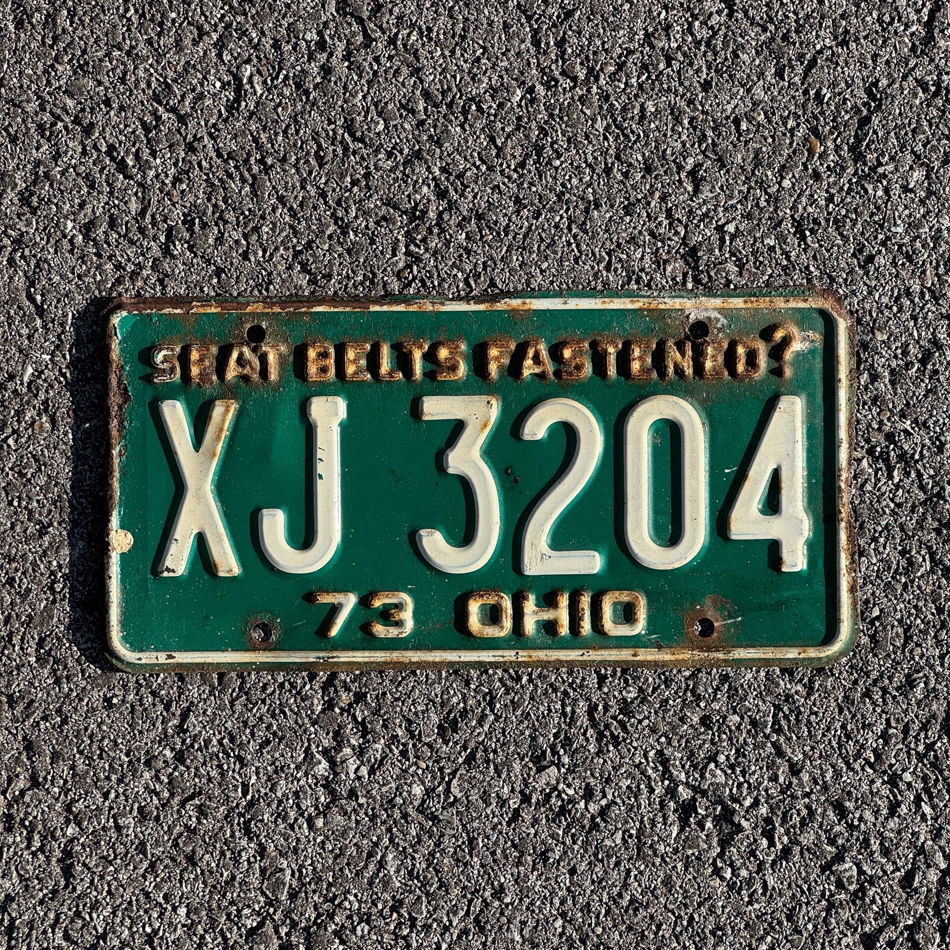 Photo of a 1973 Ohio License Plate Auto Tag Garage Decor Vintage XJ 3204