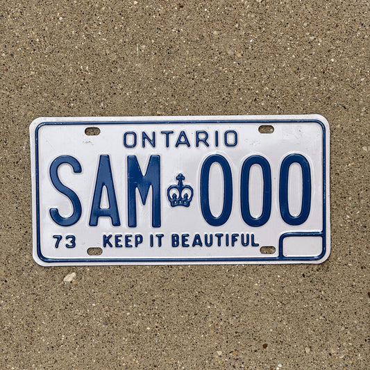 Photo of a 1973 Ontario SAMPLE License Plate Auto Tag Garage Decor Vintage SAM 000