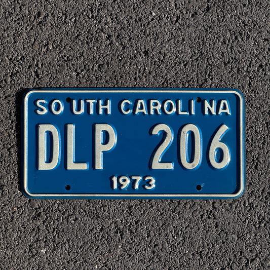 Photo of a 1973 South Carolina License Plate Auto Tag Garage Decor Vintage DLP 206 with original patina