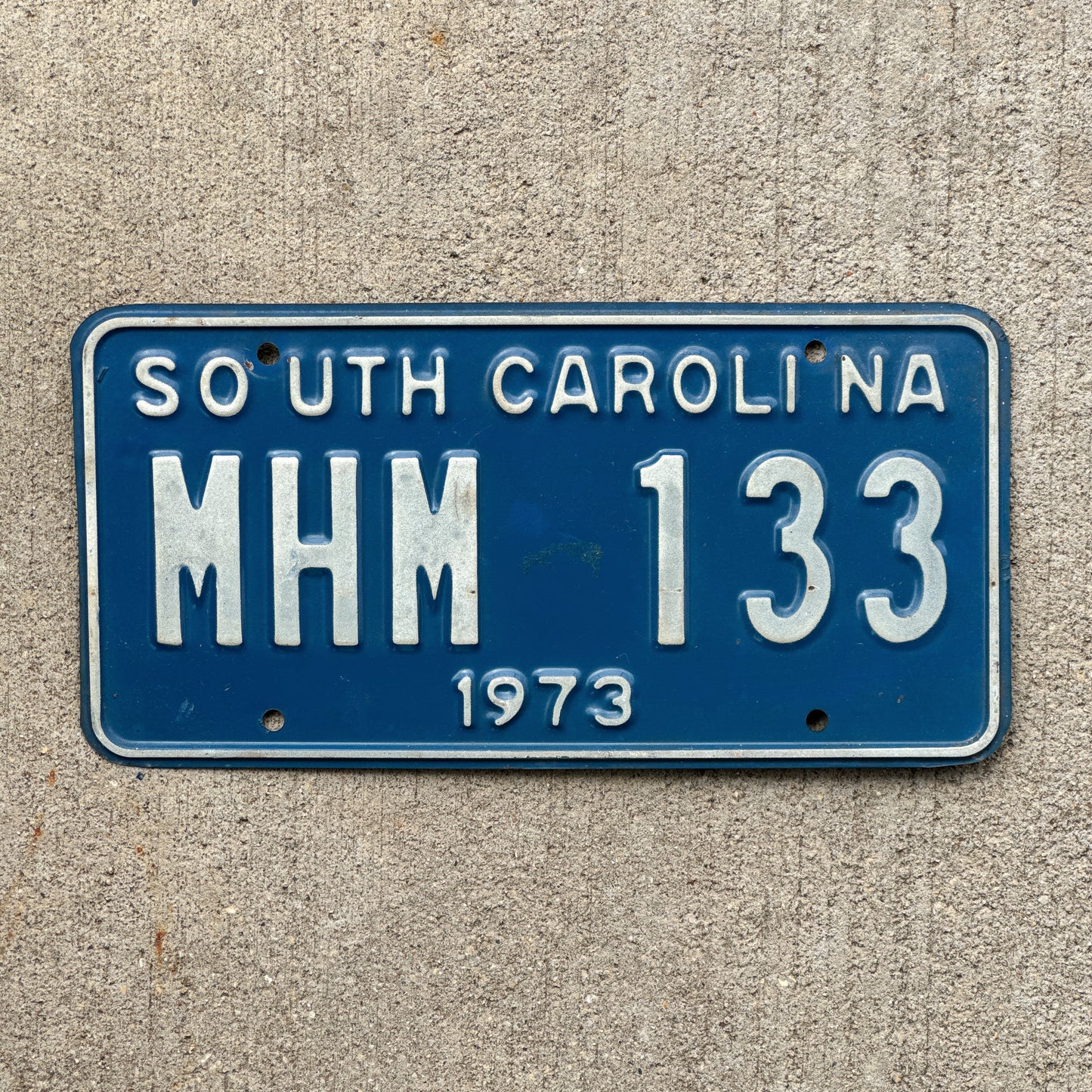 Photo of a 1973 South Carolina License Plate Auto Tag Garage Decor Vintage MHM 133 with original patina