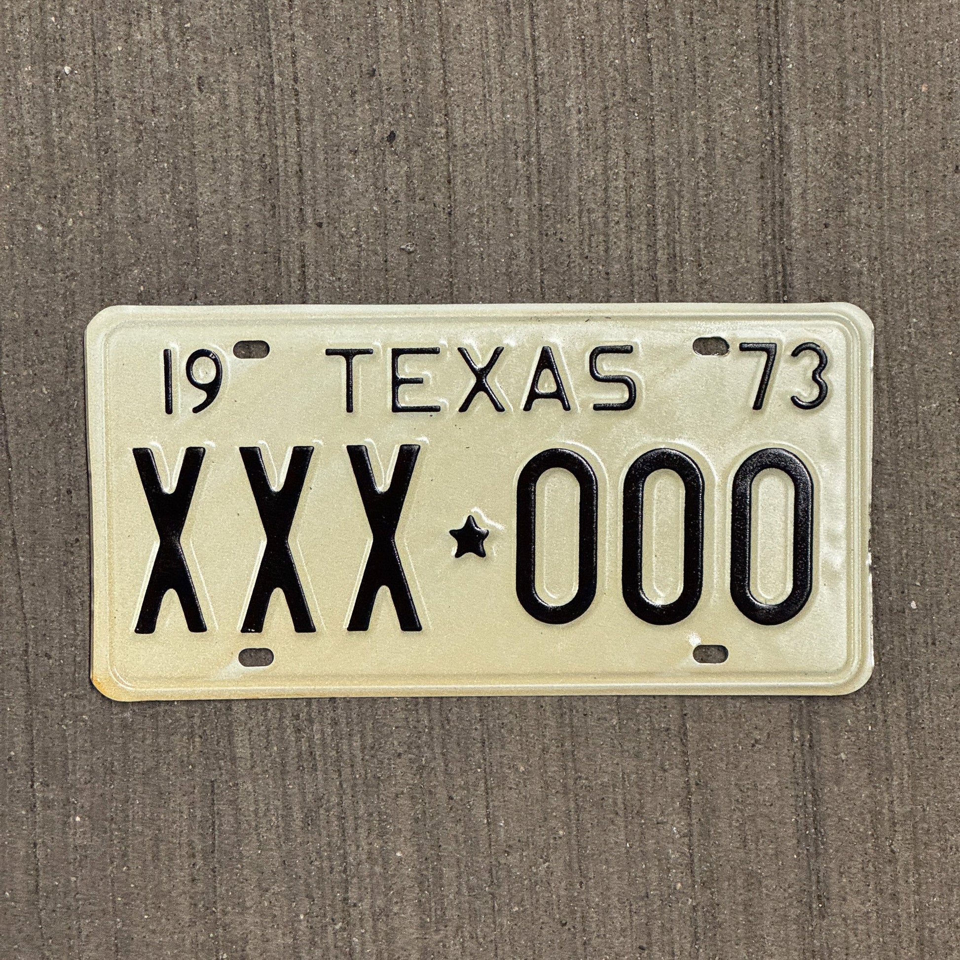 Photo of a 1973 Texas SAMPLE License Plate Auto Tag Garage Decor Vintage XXX 000