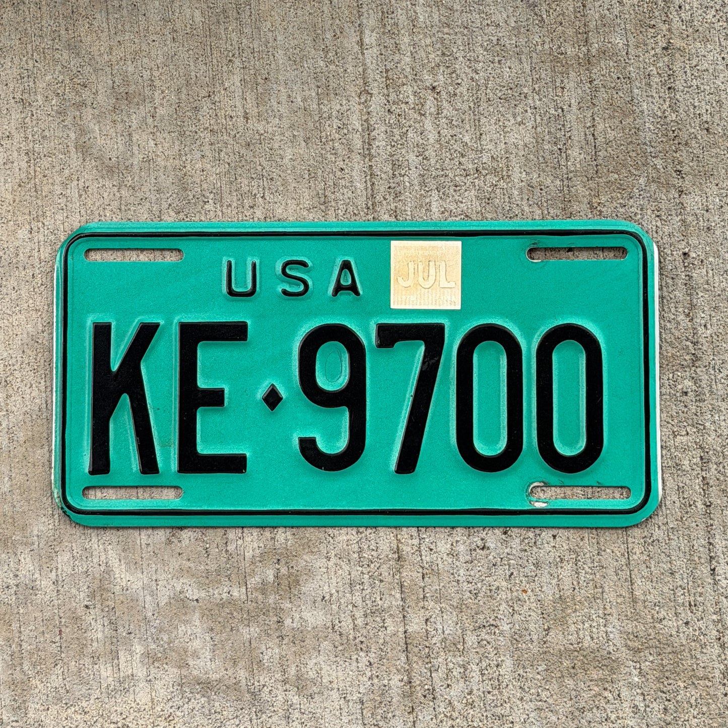 Photo of a 1973 US Forces Germany License Plate Auto Tag Garage Decor Vintage KE 9700 with original patina