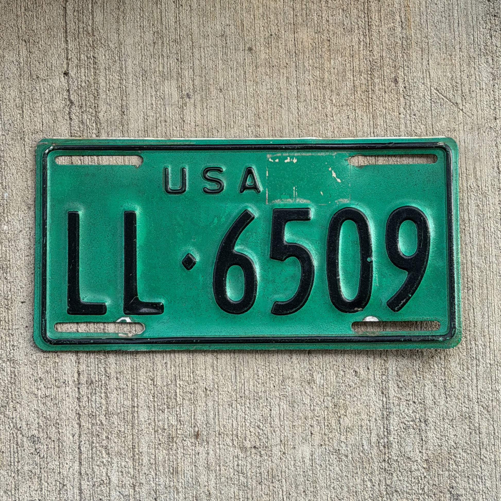 Photo of a 1973 US Forces Germany License Plate Auto Tag Garage Decor Vintage LL 6509 with original patina