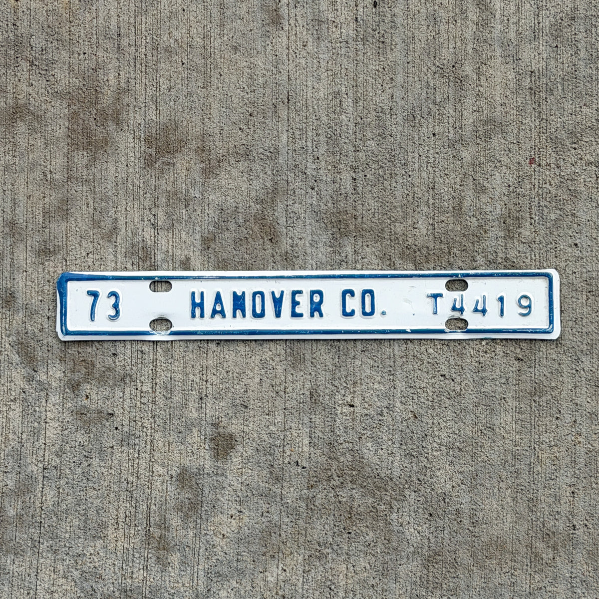 Photo of a 1973 Virginia Tax Strip License Plate Auto Tag Garage Decor Vintage Hanover County T 4419 with original patina