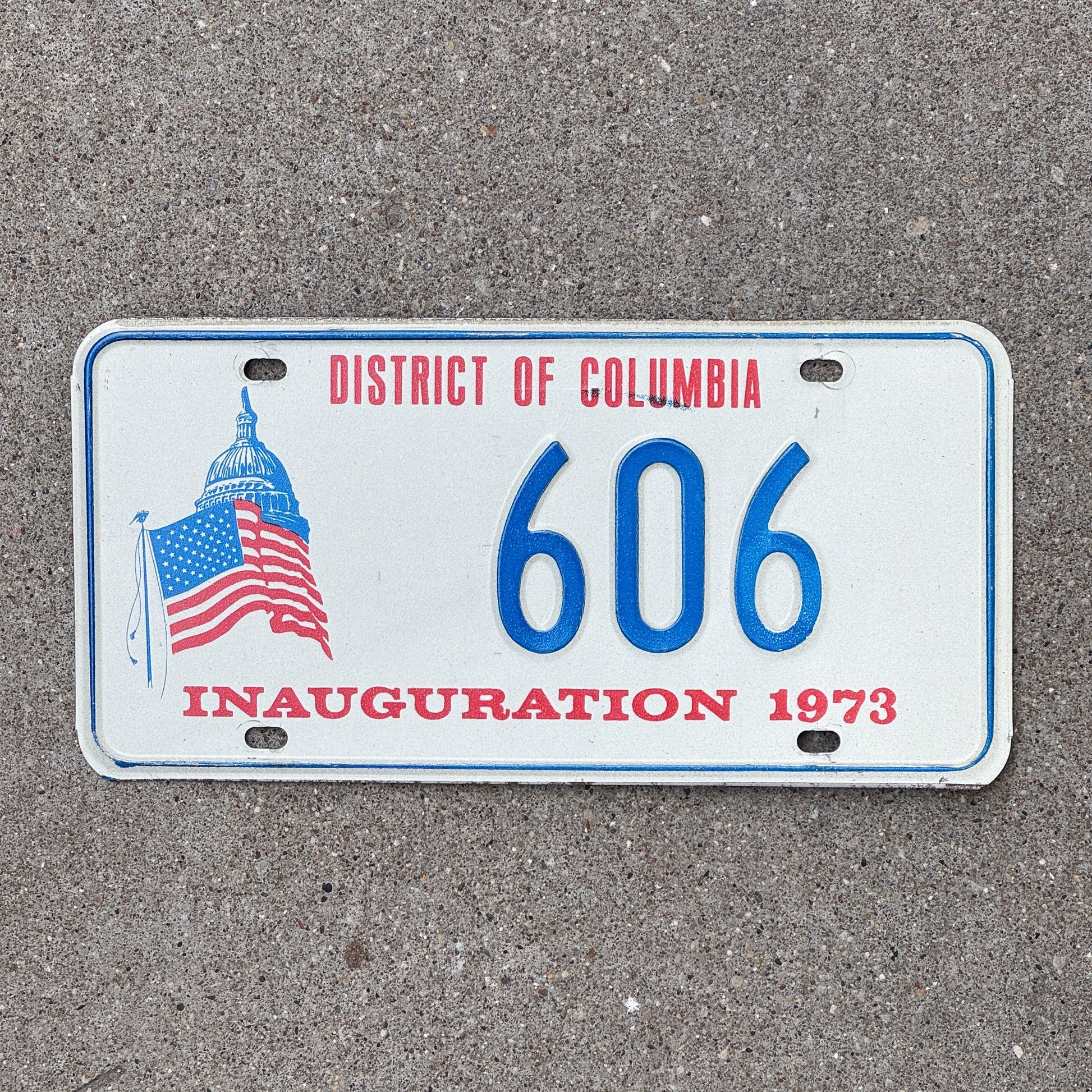 Photo of a 1973 Washington DC Inaugural License Plate Auto Tag Garage Decor Vintage Nixon Politics Political Low Number Three Digit 606 with original patina