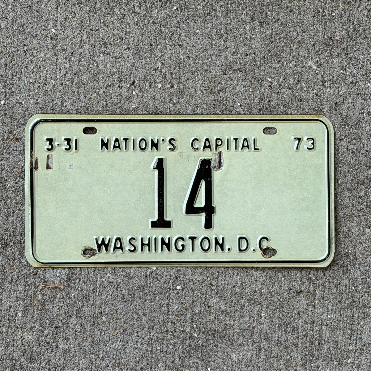 Photo of a 1973 Washington DC License Plate Auto Tag Garage Decor Vintage Low Number Two Digit 14 with original patina