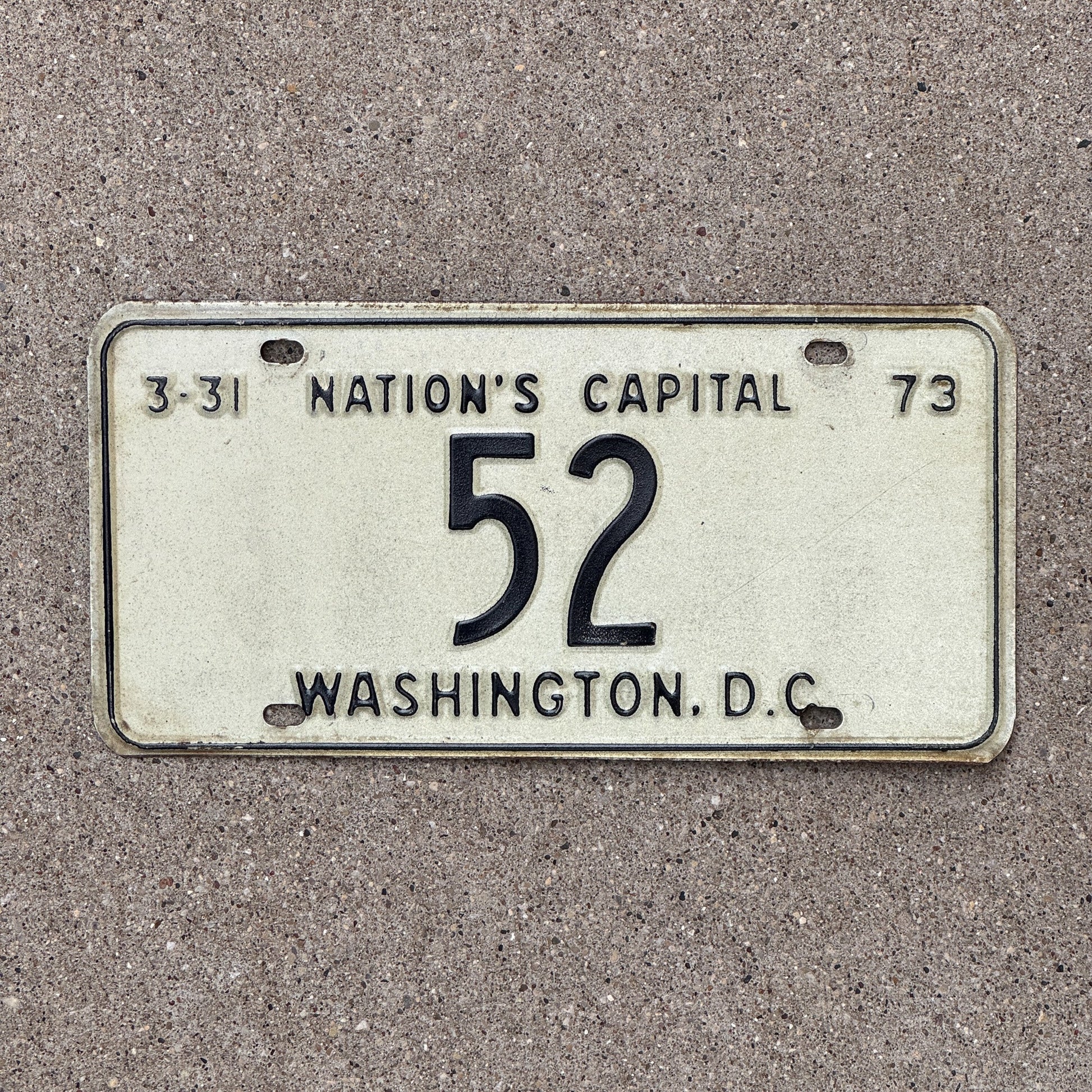 Photo of a 1973 Washington DC License Plate Auto Tag Garage Decor Vintage Low Number Two Digit 52 with original patina