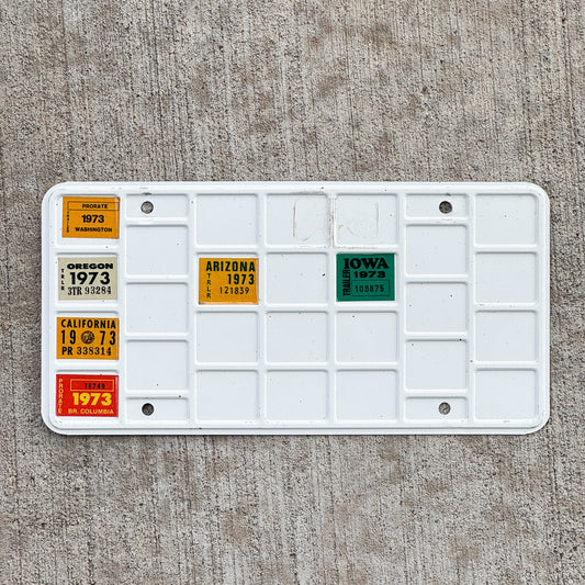 Photo of a 1973 Washington Reciprocity Prorate Bingo Sticker License Plate Auto Tag 3 Vintage with original patina
