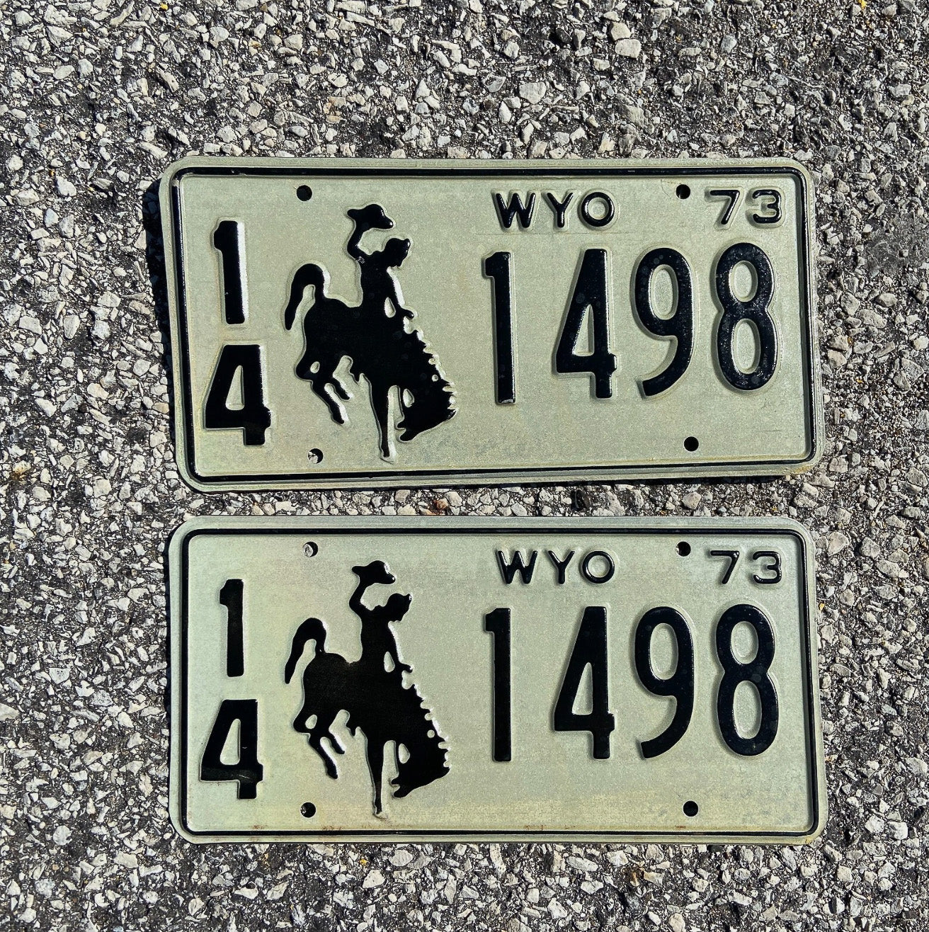 Photo of a 1973 Wyoming License Plate Pair Auto Tag Garage Decor Vintage Cowboy Rodeo 14 1498 with original patina