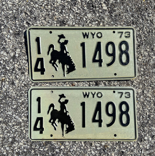 Photo of a 1973 Wyoming License Plate Pair Auto Tag Garage Decor Vintage Cowboy Rodeo 14 1498 with original patina