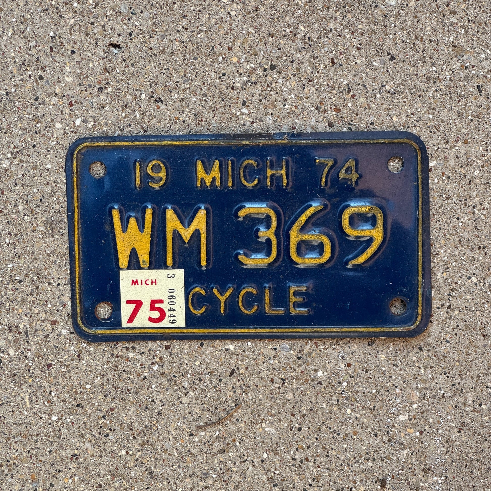 Photo of a 1974 1975 Michigan Motorcycle License Plate Auto Tag Garage Decor Vintage WM 369