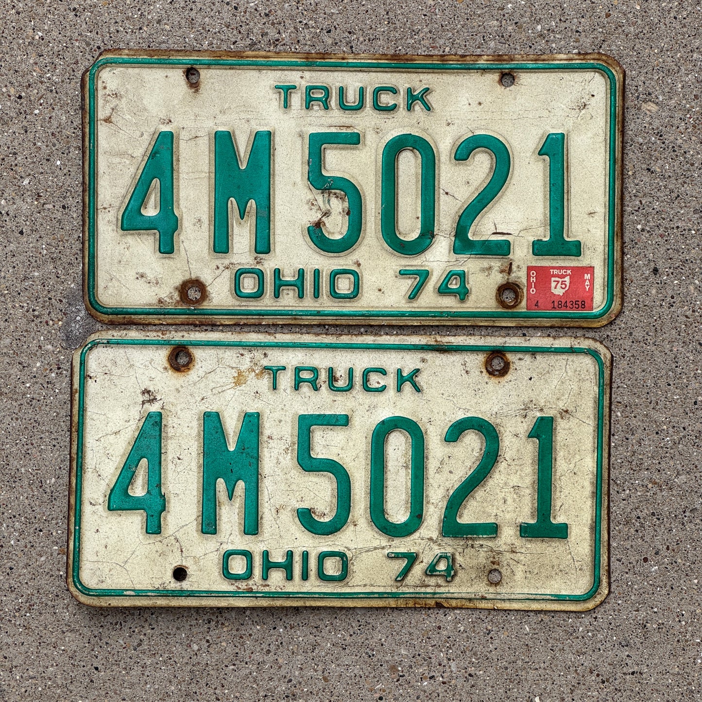 Photo of a 1974 1975 Ohio Truck License Plate Pair Auto Tag Garage Decor Vintage 4 M 5021 with original patina