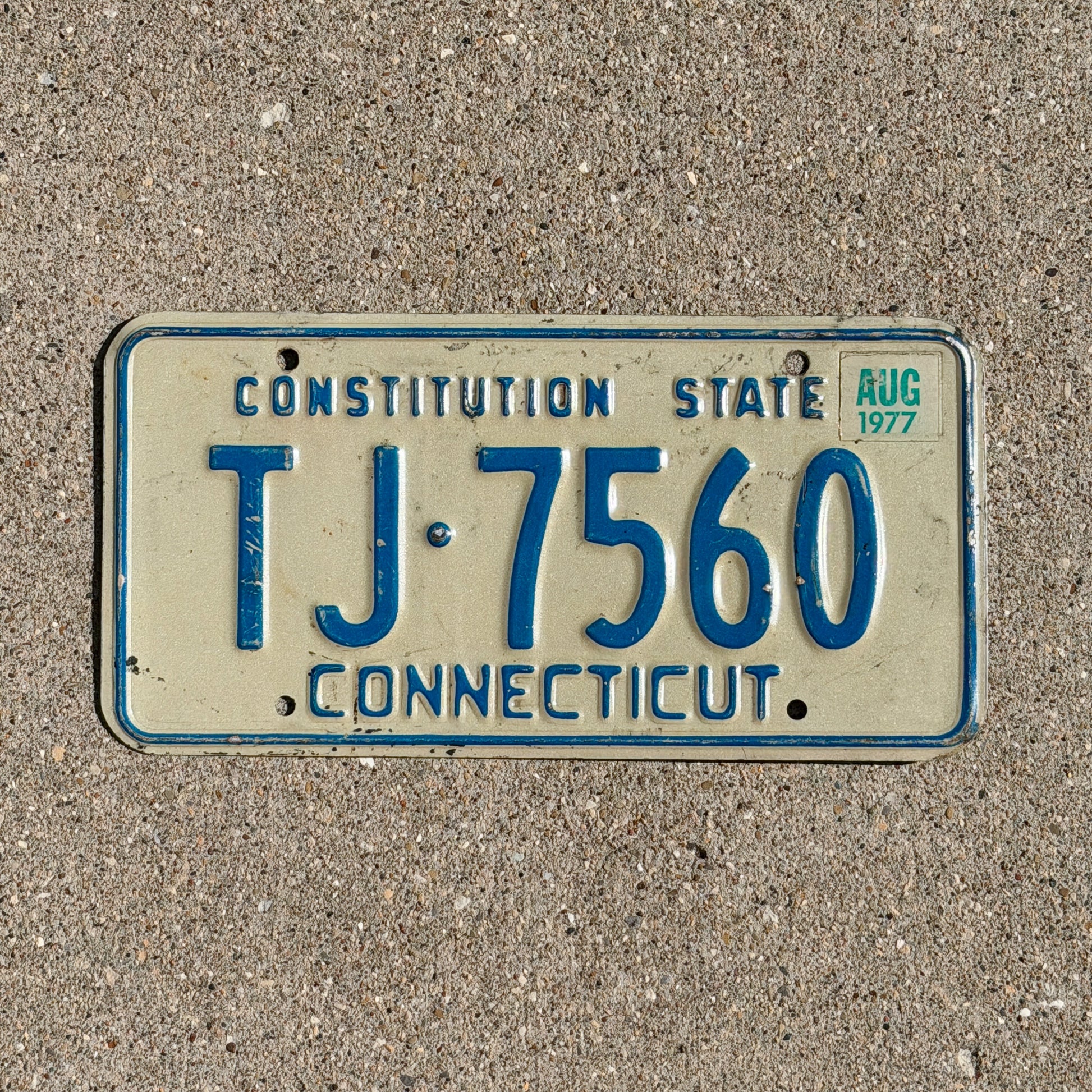 Photo of a 1974 1977 Connecticut License Plate Auto Tag Garage Decor Vintage TJ 7560 with original patina
