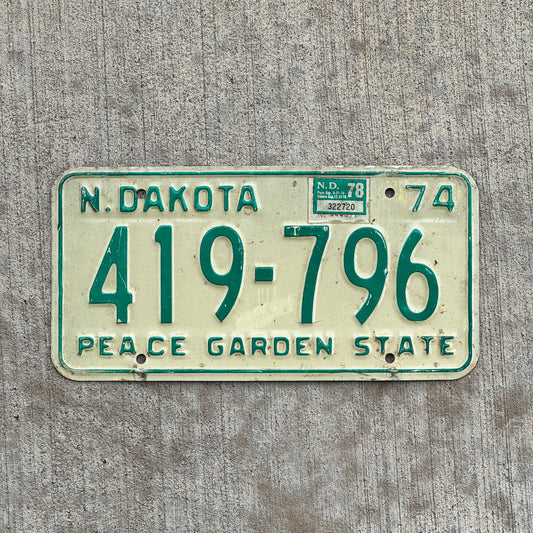 Photo of a 1974 1978 North Dakota License Plate Auto Tag Garage Decor Vintage 419 796 with original patina