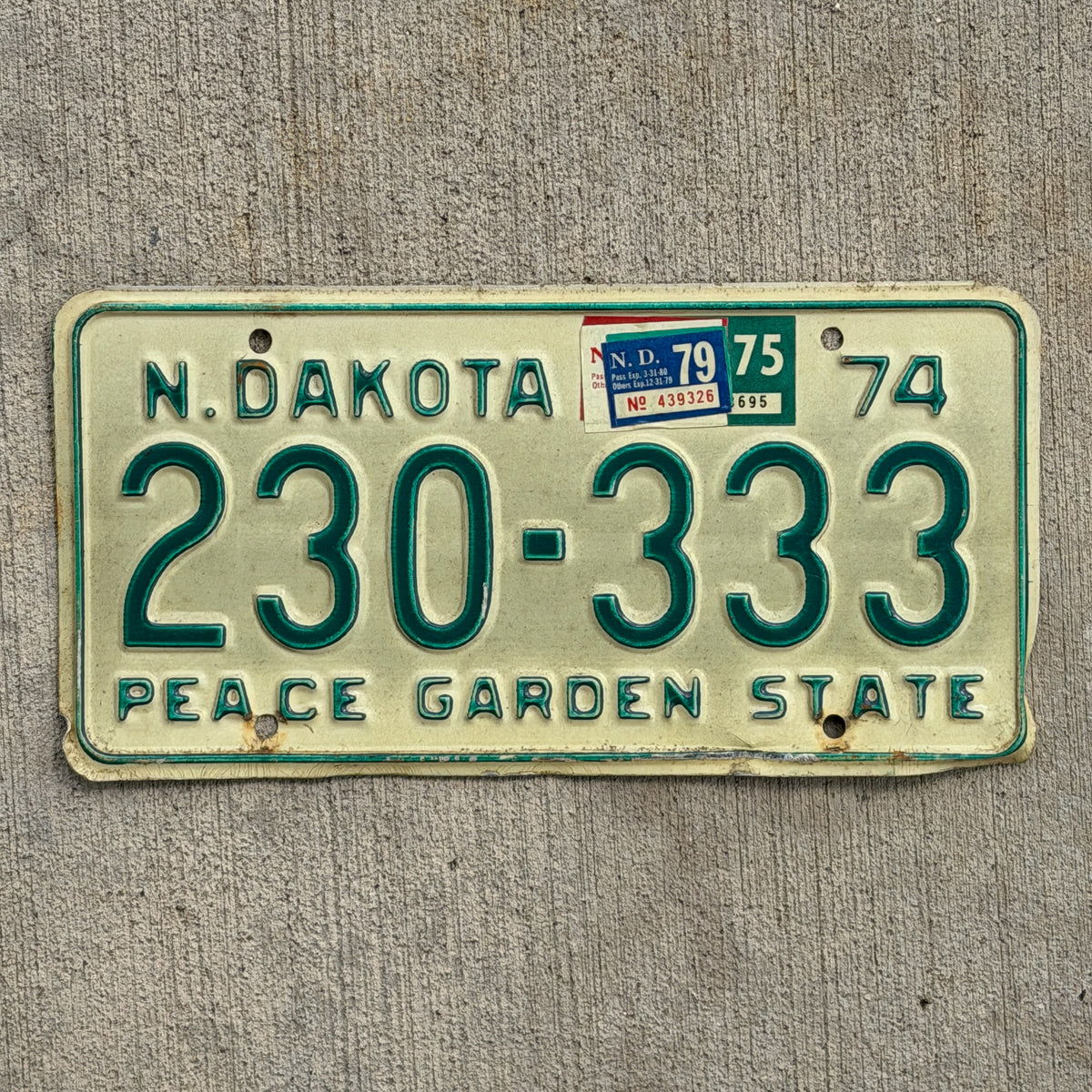 Photo of a 1974 1979 North Dakota License Plate Auto Tag Garage Decor Vintage Repeat Repeating 230 333 with original patina
