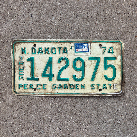 Photo of a 1974 1979 North Dakota Truck License Plate Auto Tag Garage Decor Vintage 142975 with original patina