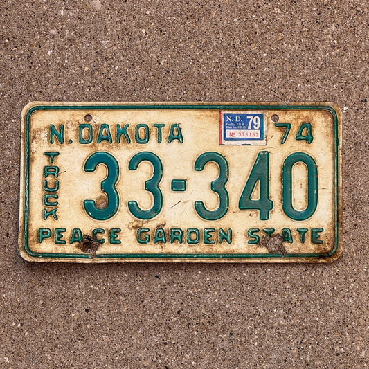 Photo of a 1974 1979 North Dakota Truck License Plate Auto Tag Garage Decor Vintage 33 340 with original patina