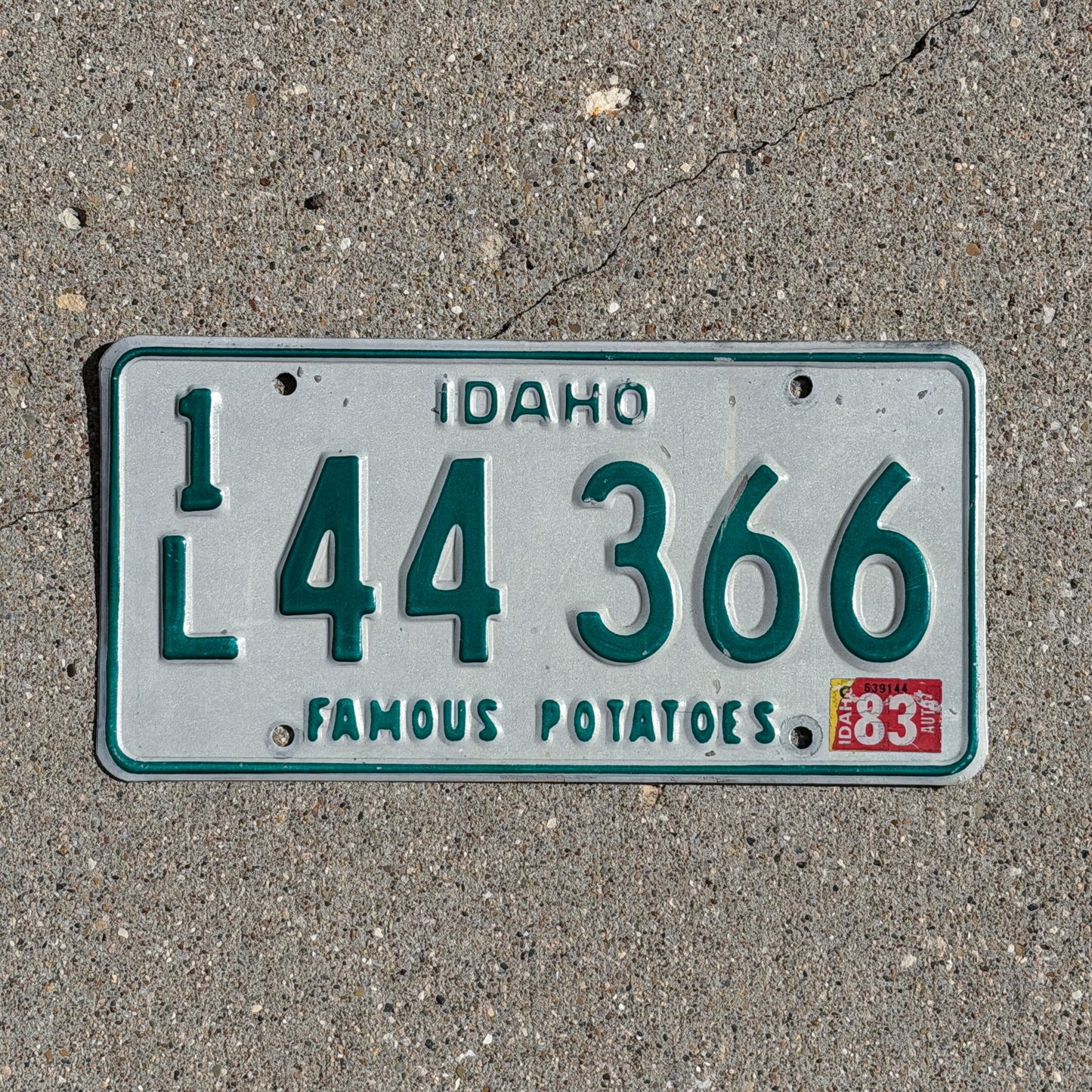 Photo of a 1974 1983 Idaho License Plate Auto Tag 2 Vintage Garage 1L 44 366 with original patina