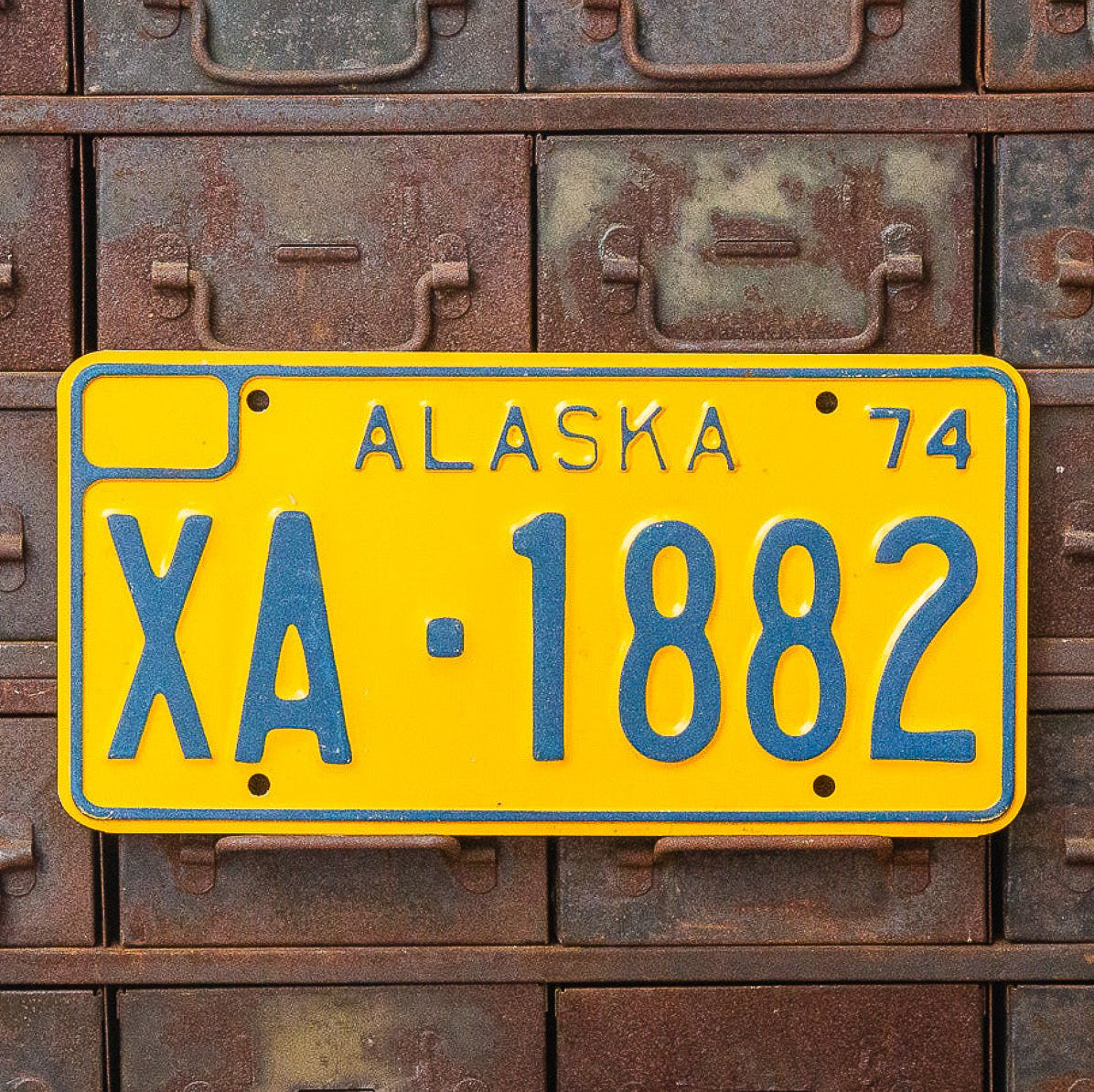 Photo of a 1974 Alaska Government License Plate Auto Tag Garage Decor Vintage XA 1882 with original patina