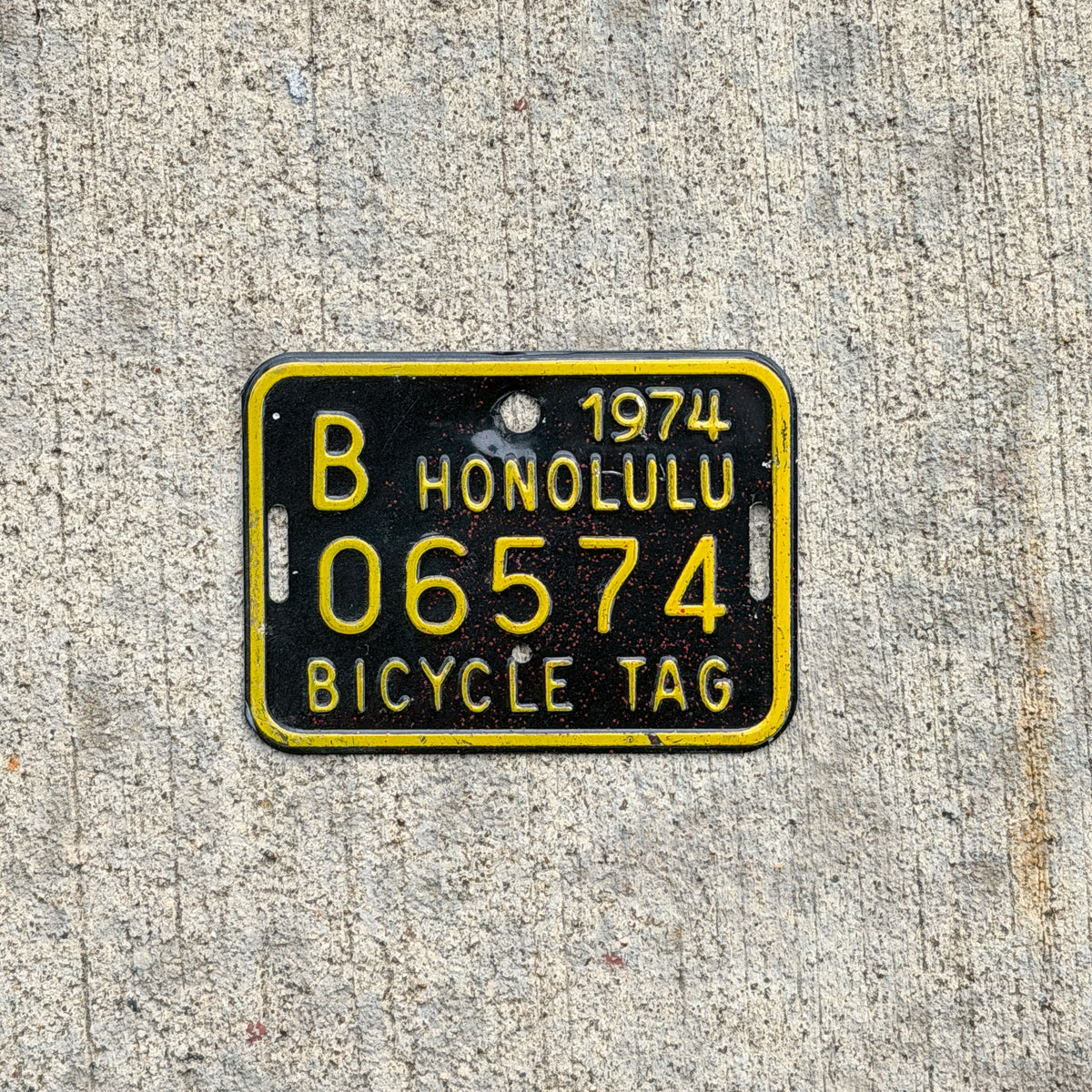 Photo of a 1974 Honolulu Hawaii Bicycle License Plate Auto Tag Garage Decor Vintage Bike B 06574 with original patina