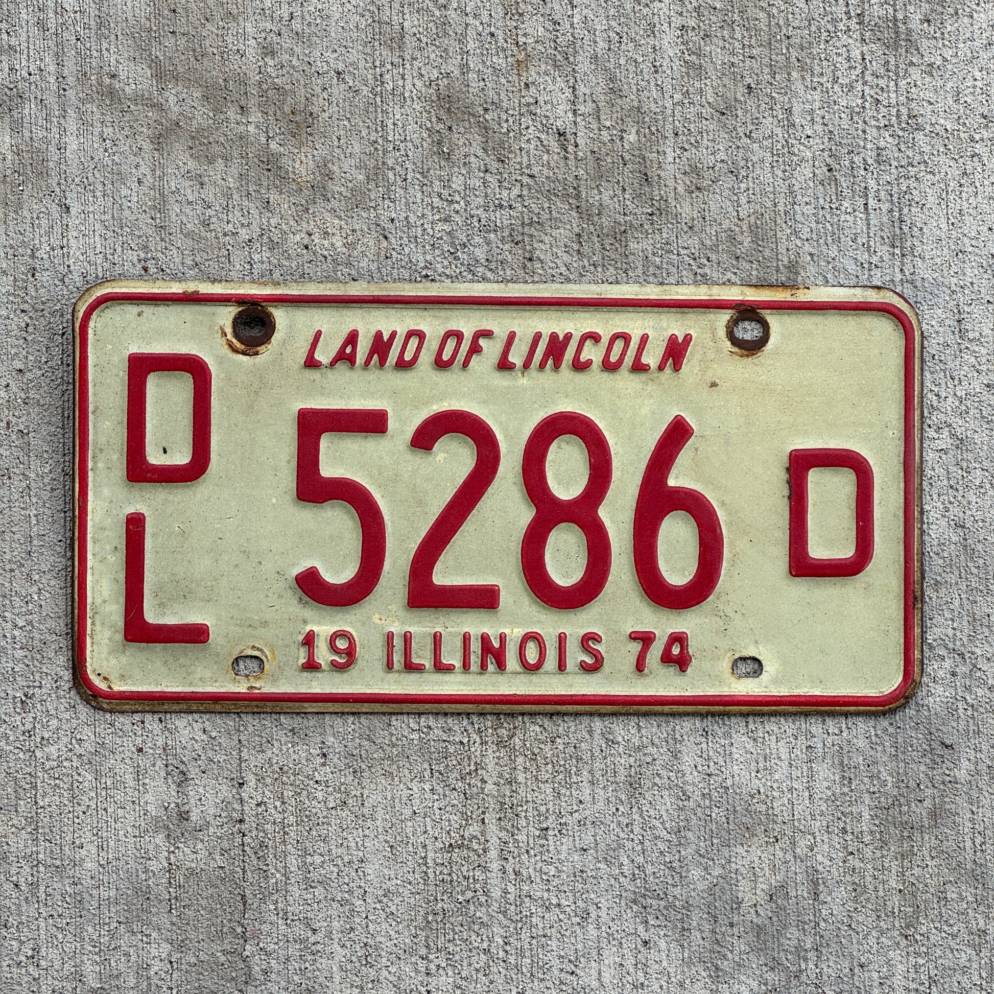 Photo of a 1974 Illinois Dealer License Plate Auto Tag 1 Vintage Garage 5286 D with original patina