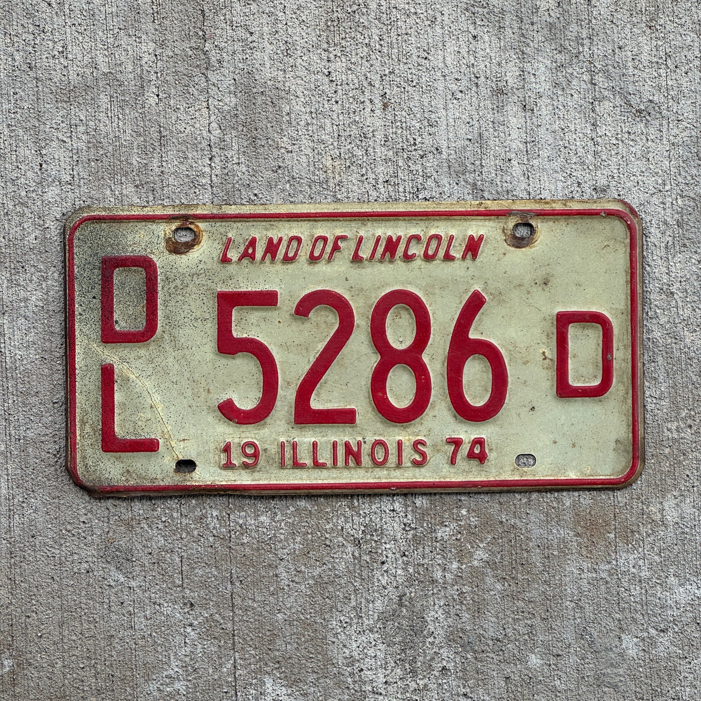 Photo of a 1974 Illinois Dealer License Plate Auto Tag 2 Vintage Garage 5286 D with original patina