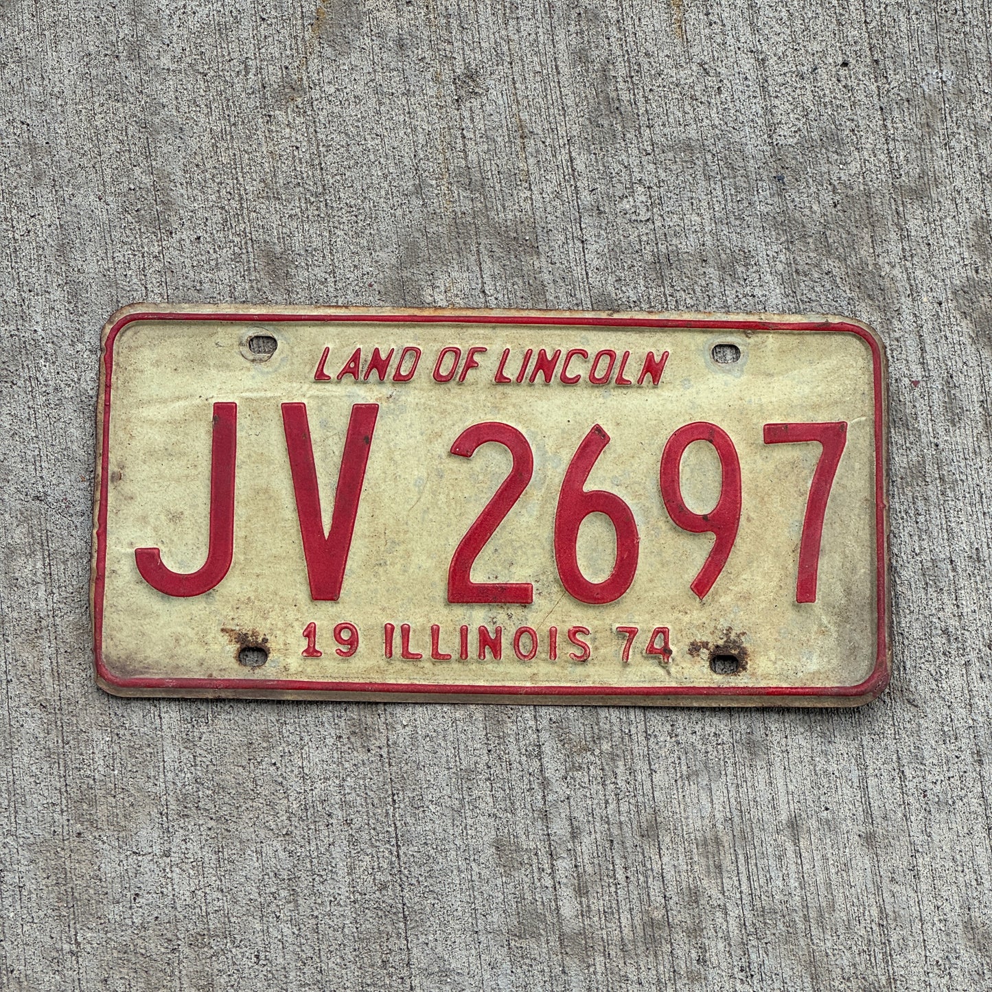 Photo of a 1974 Illinois License Plate Auto Tag 1 Vintage Garage JV 2697 with original patina