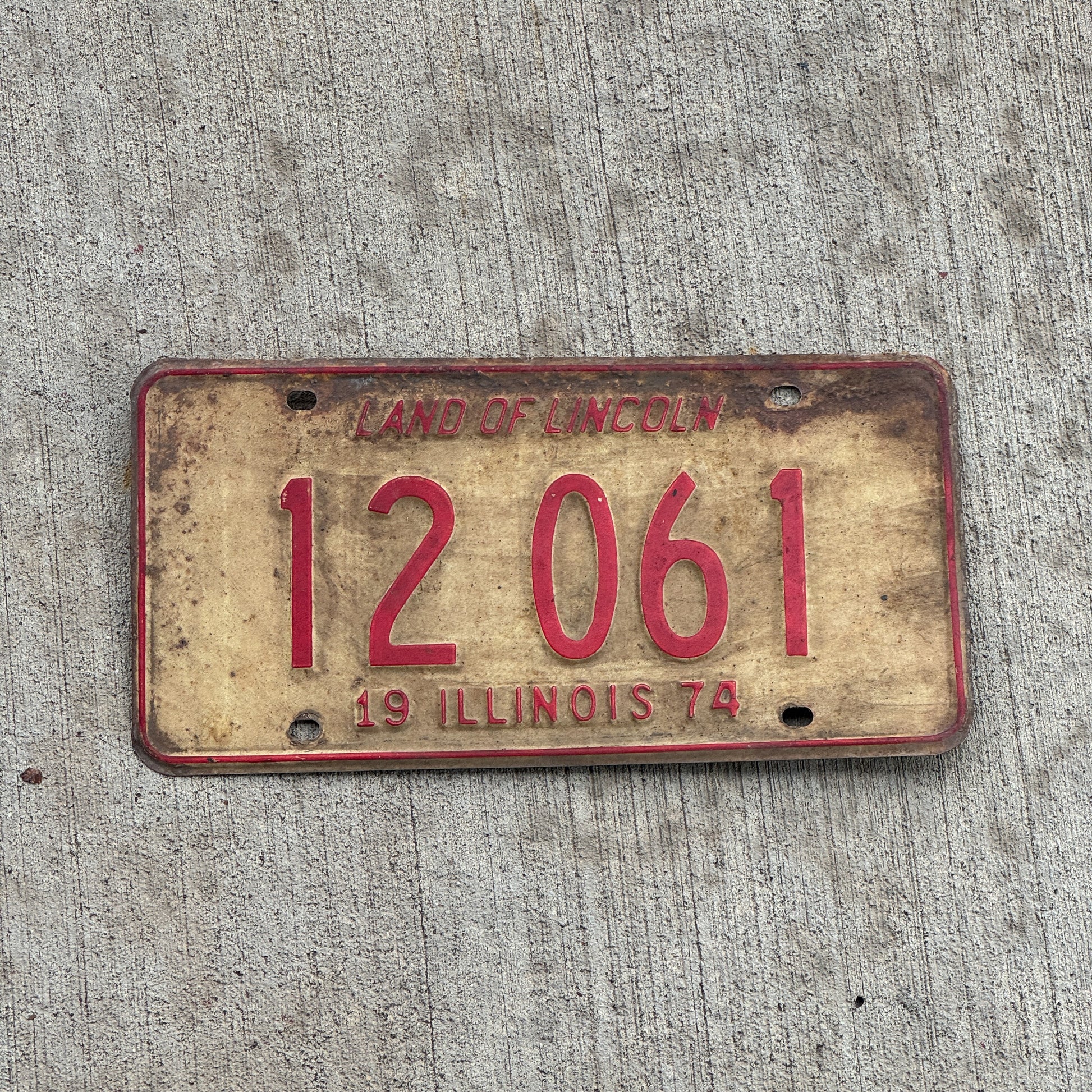 Photo of a 1974 Illinois License Plate Auto Tag 2 Vintage Garage 12 061 with original patina