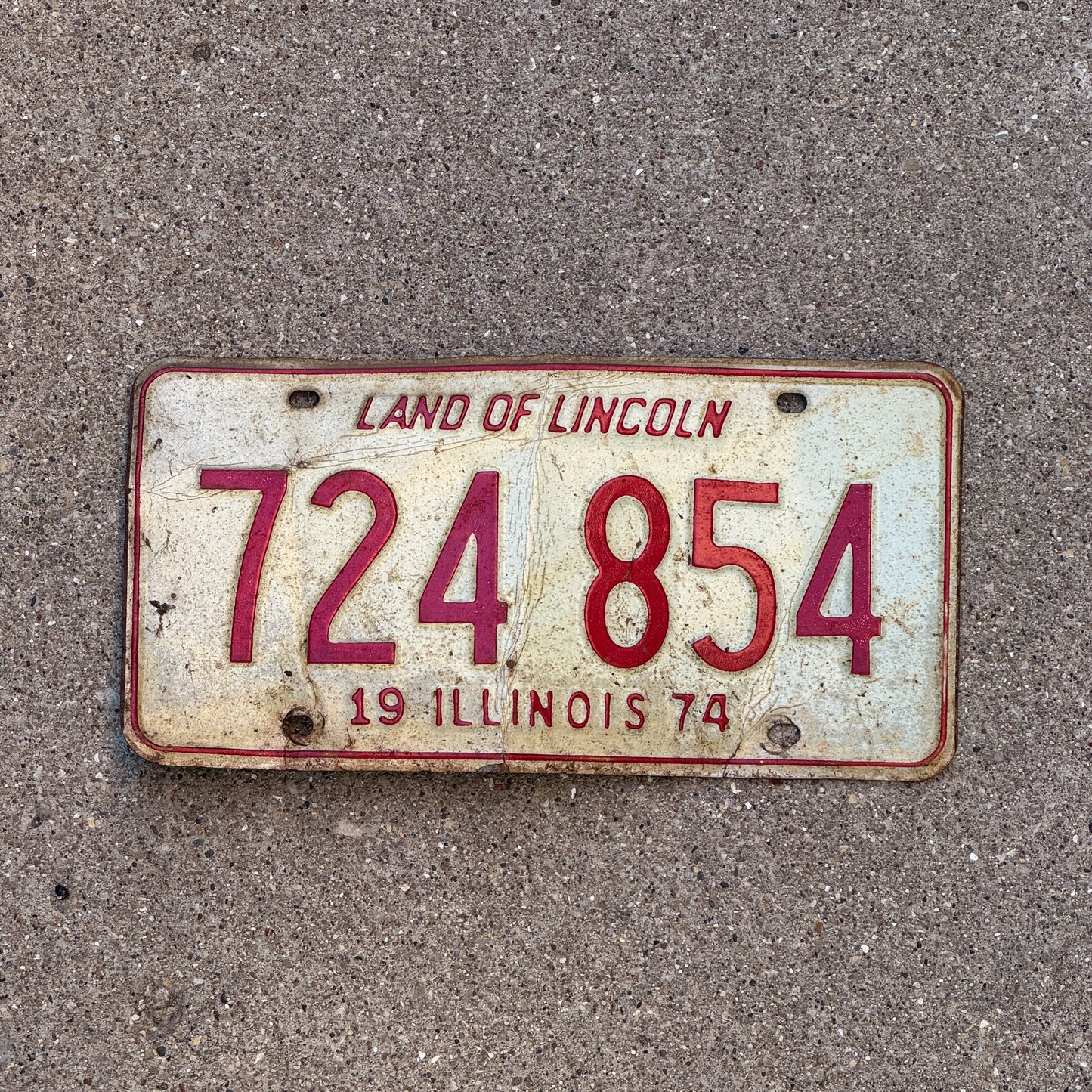 Photo of a 1974 Illinois License Plate Auto Tag 2 Vintage Garage 724 854 with original patina