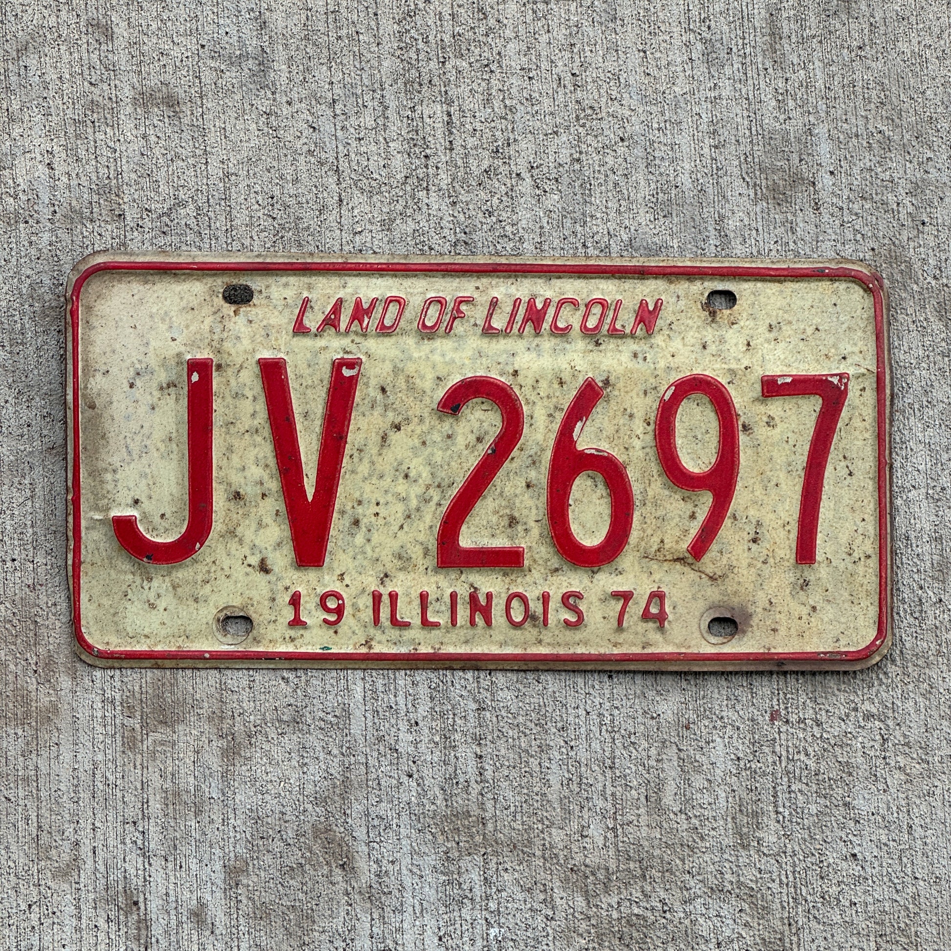 Photo of a 1974 Illinois License Plate Auto Tag 2 Vintage Garage JV 2697 with original patina